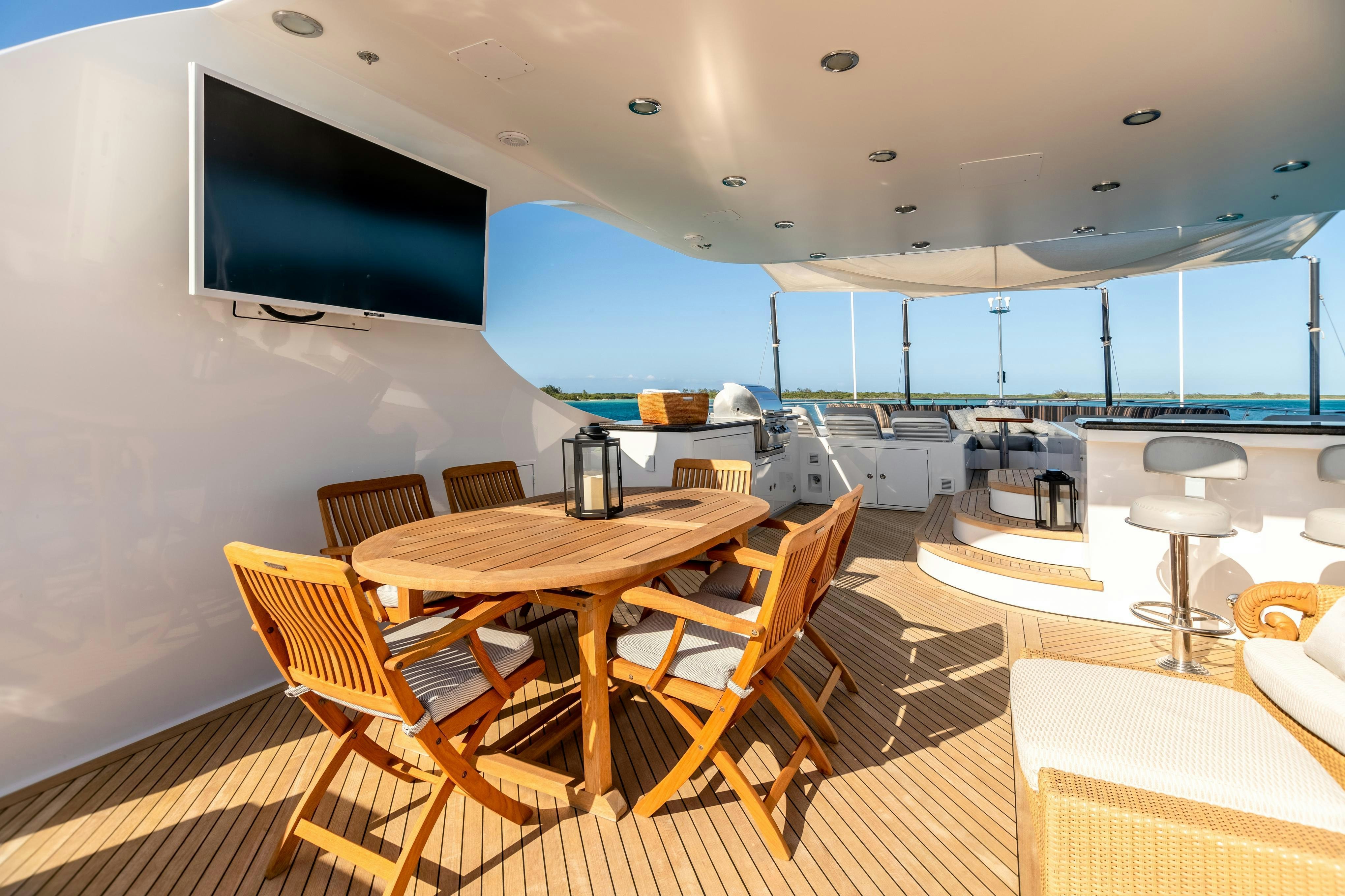 a room with a table and chairs aboard TCB Yacht for Charter