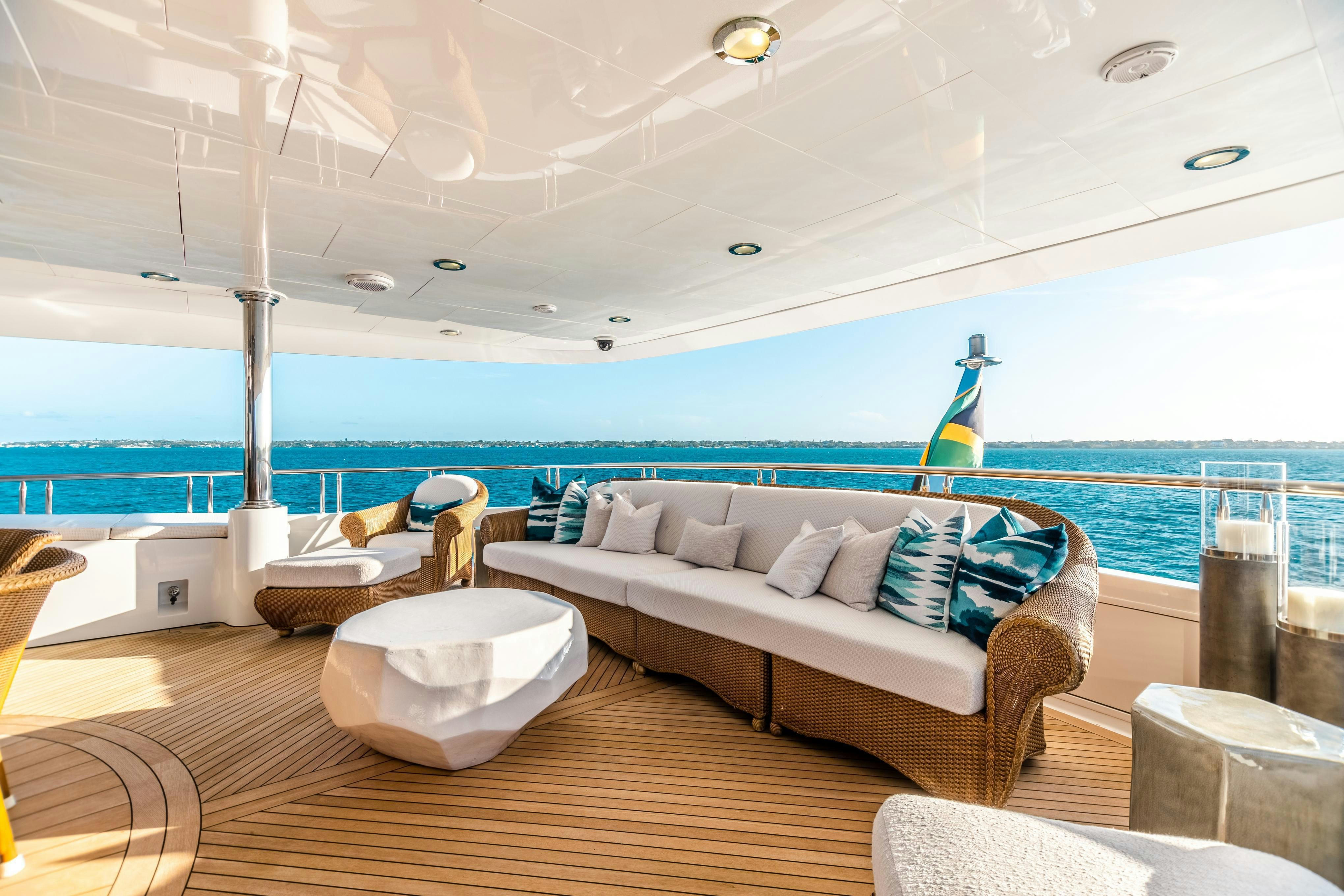 a room with a couch and a pool aboard TCB Yacht for Charter