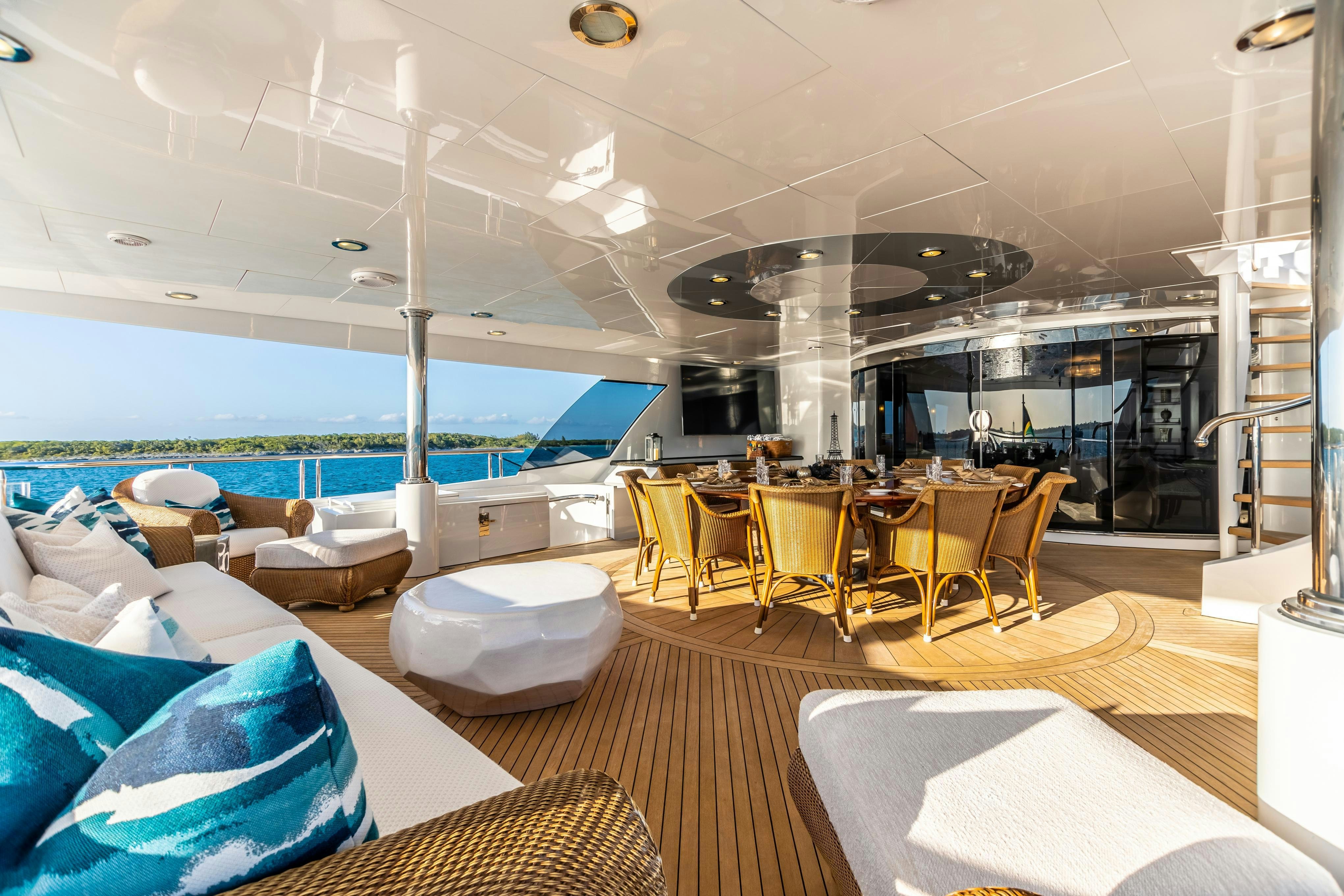 a room with a table chairs and a large window aboard TCB Yacht for Charter