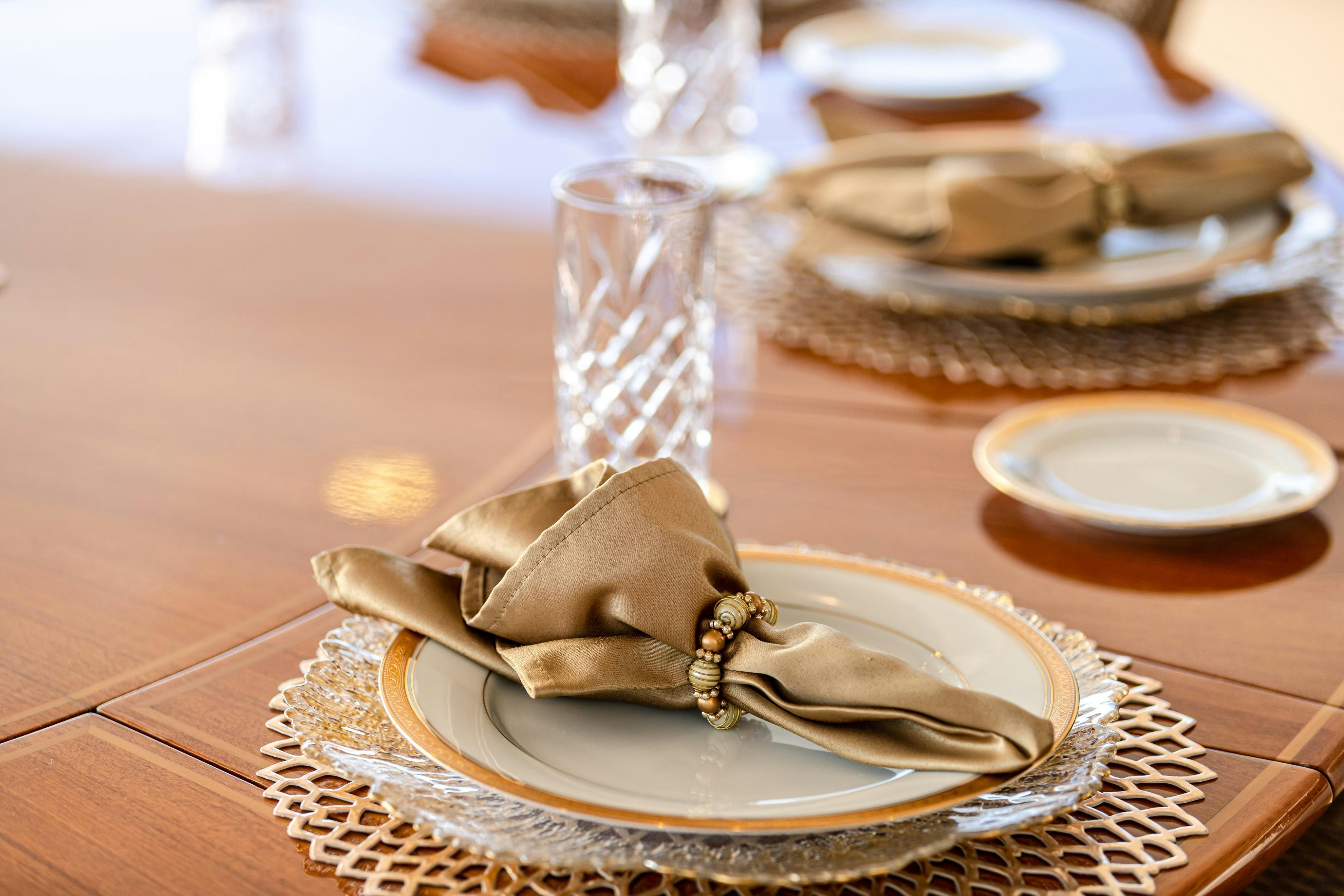 a plate of desserts and a glass of water on a table aboard TCB Yacht for Charter