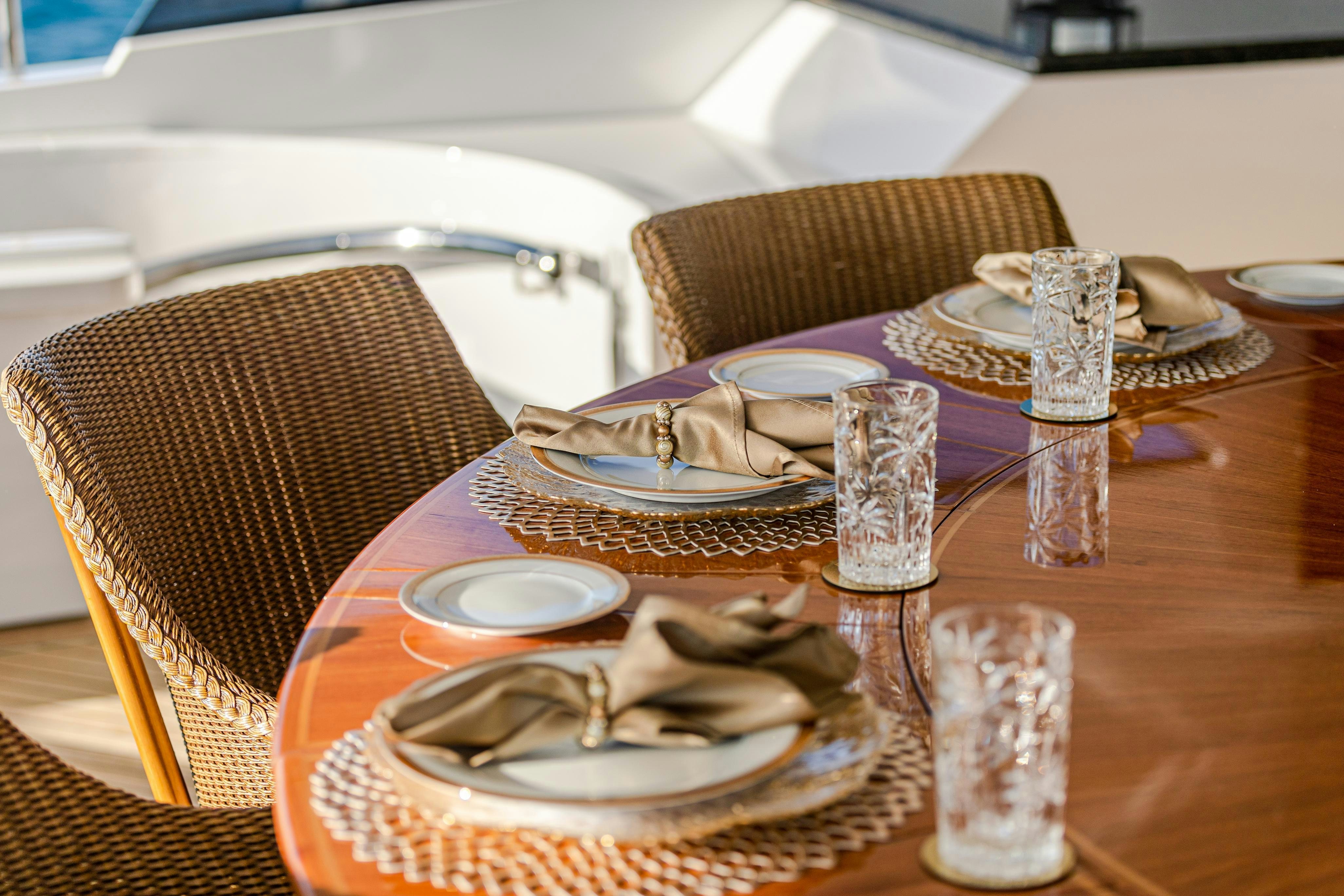 a table with plates and silverware aboard TCB Yacht for Charter