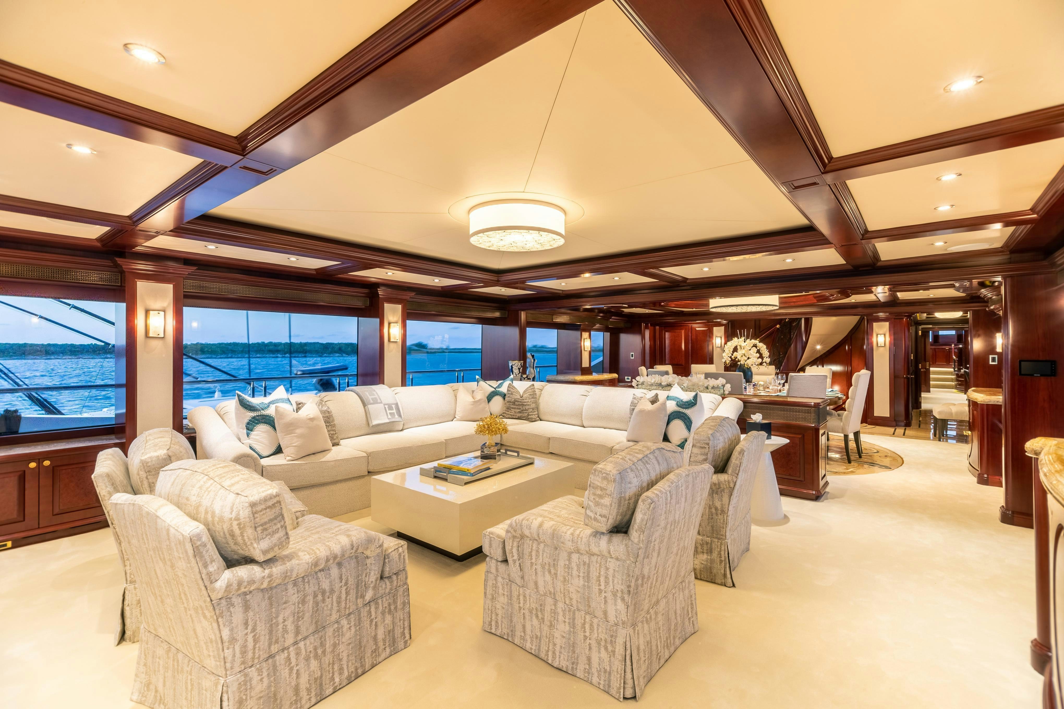 a large living room with a large window aboard TCB Yacht for Charter