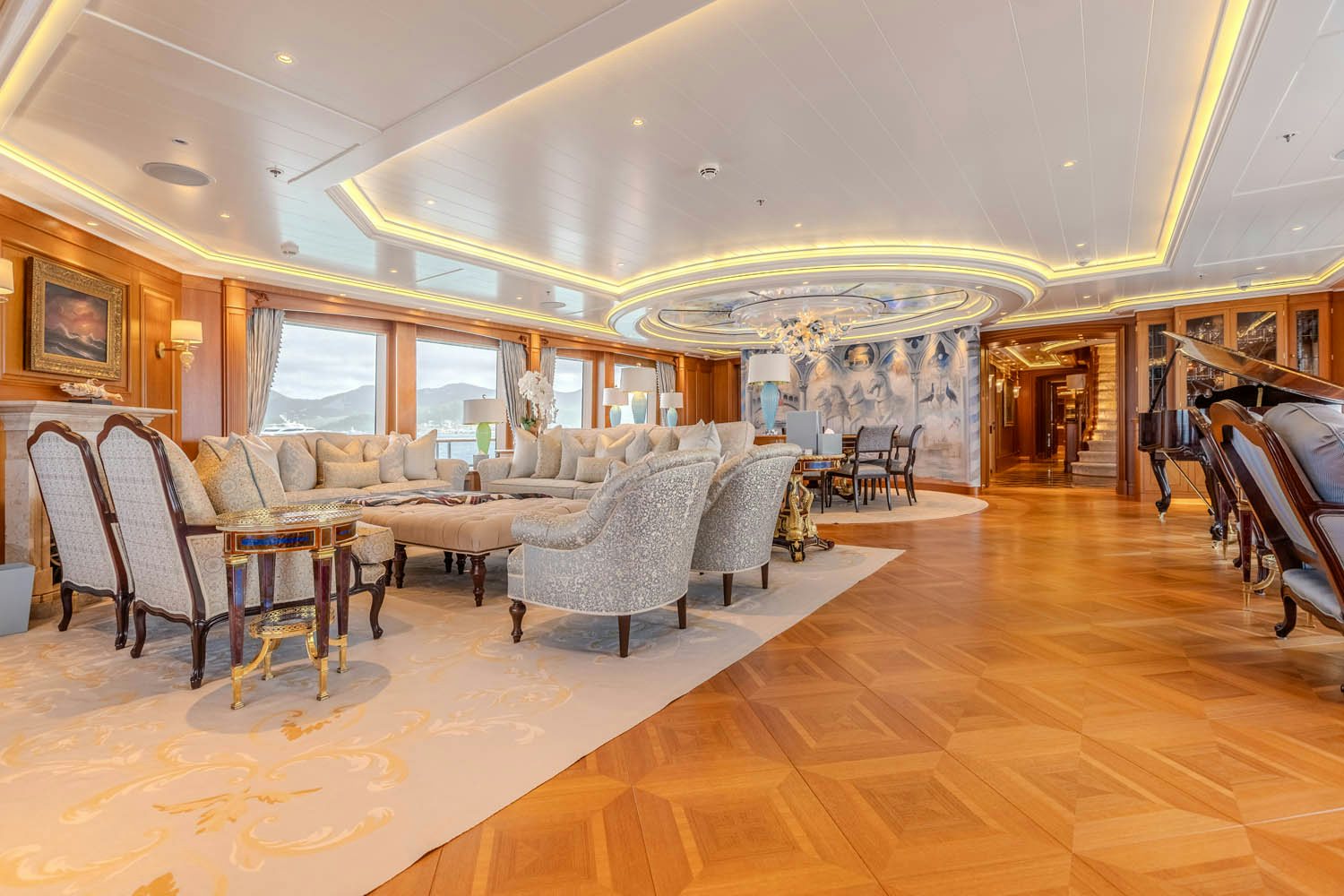 a large living room with a large chandelier aboard SEA OWL Yacht for Charter