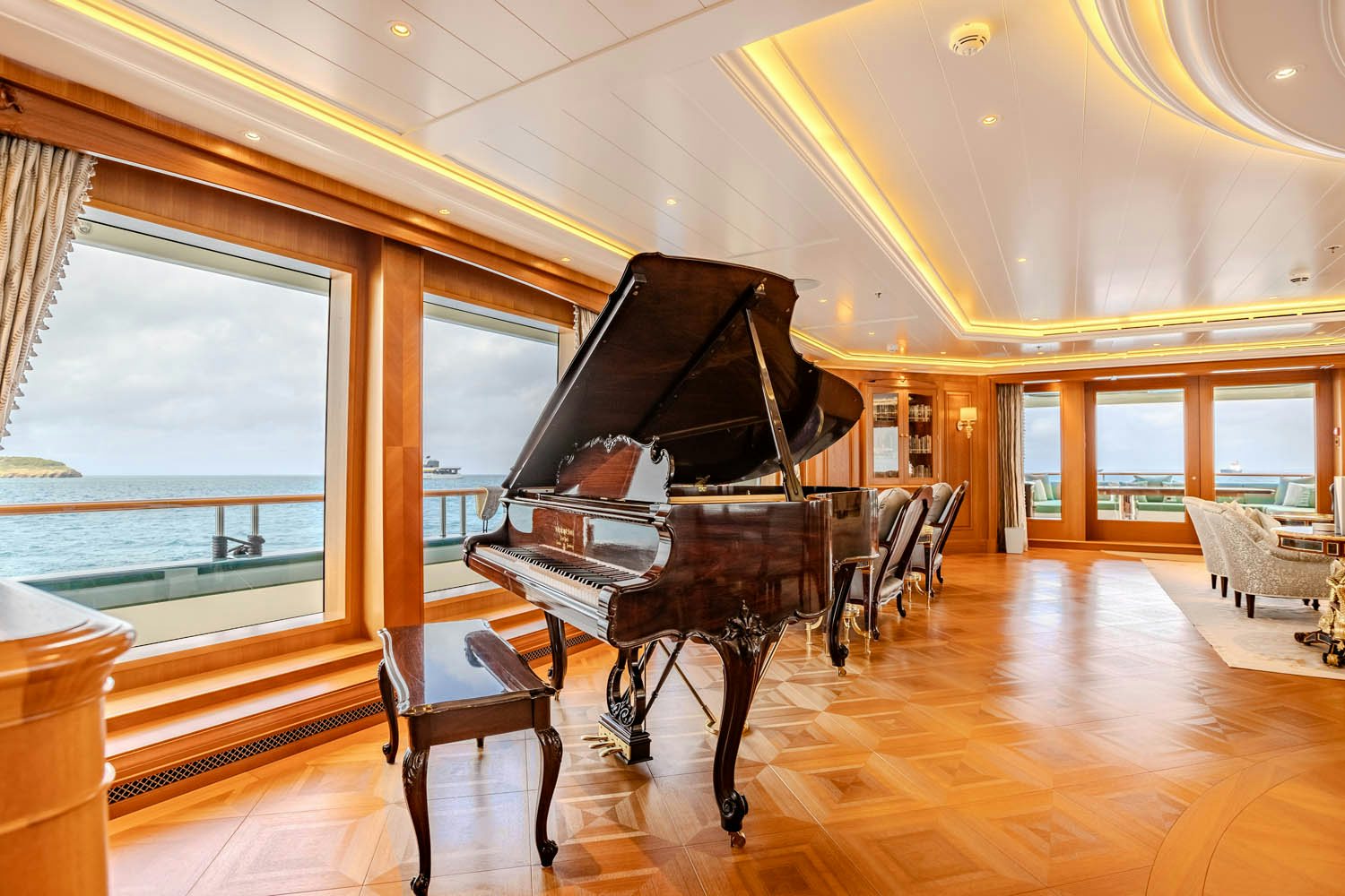 a piano in a room aboard SEA OWL Yacht for Charter