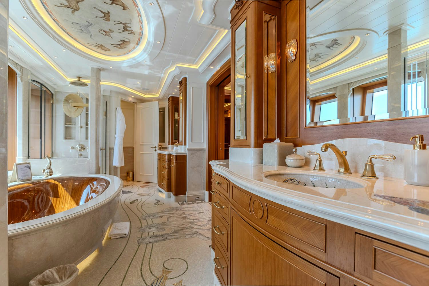a bathroom with a large bathtub and a large sink aboard SEA OWL Yacht for Charter