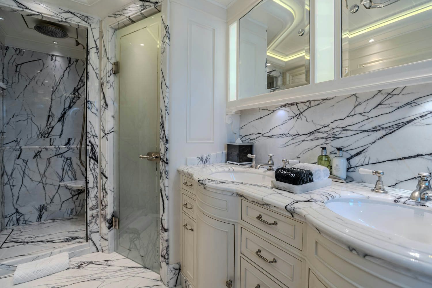 a bathroom with a sink and a mirror aboard SEA OWL Yacht for Charter