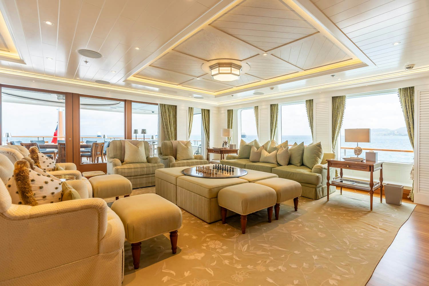 a living room with a large window aboard SEA OWL Yacht for Charter
