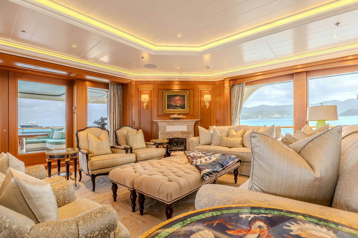 a living room with a large window aboard SEA OWL Yacht for Charter