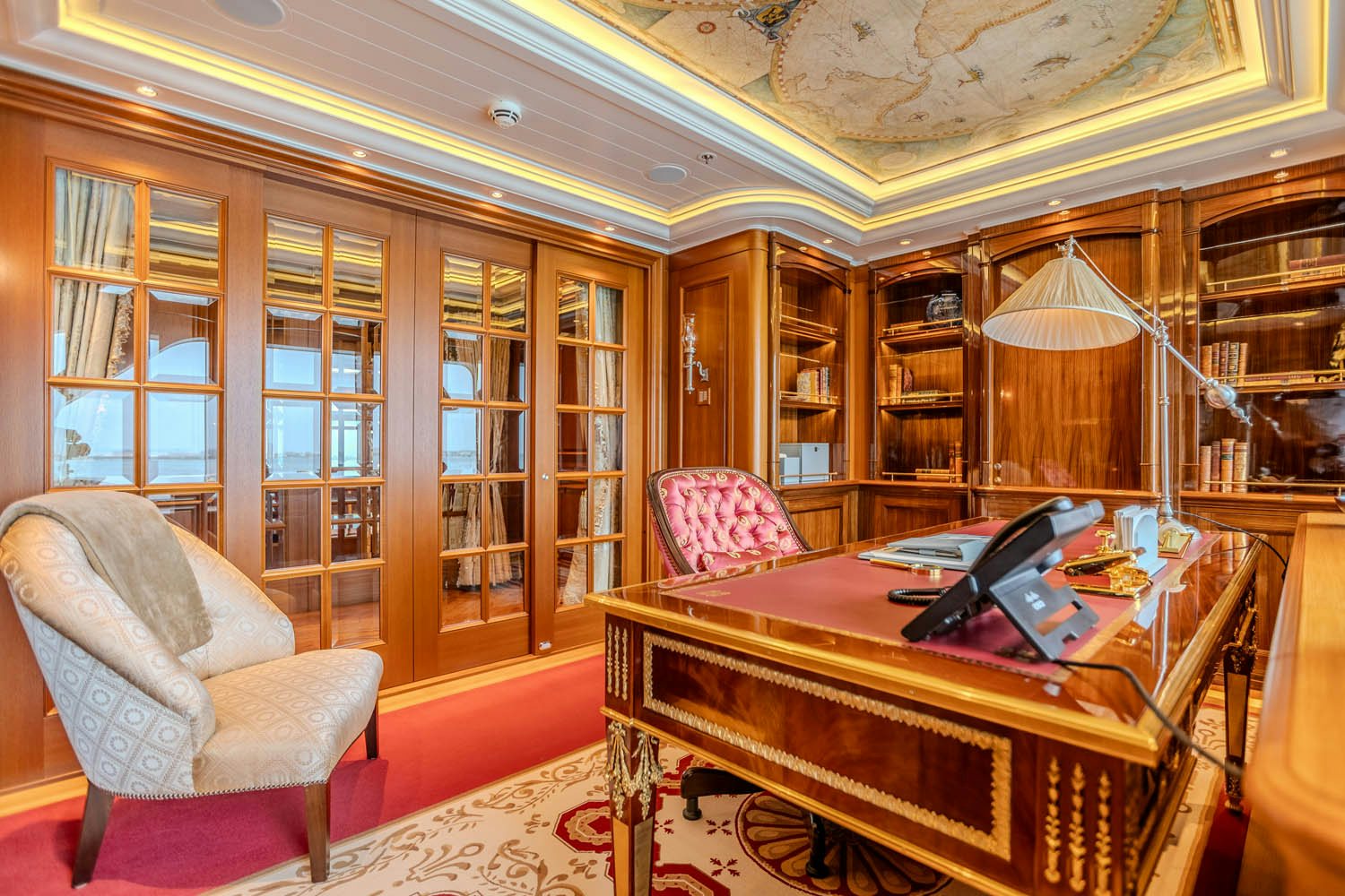 a room with a piano and a chair aboard SEA OWL Yacht for Charter