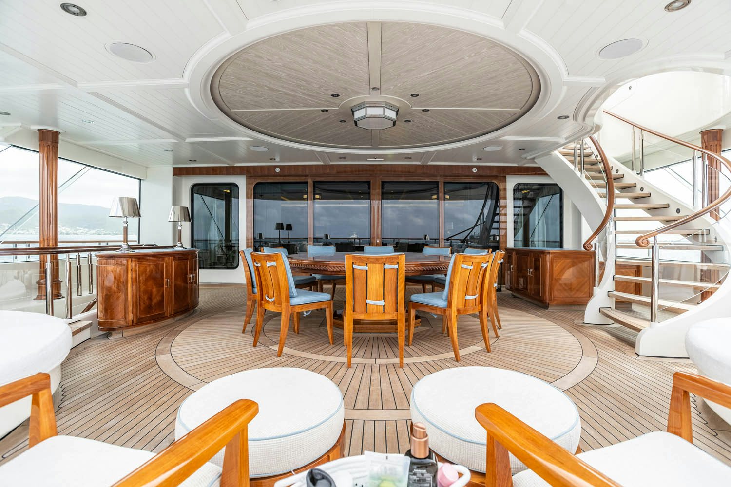 a large room with a staircase and chairs aboard SEA OWL Yacht for Charter