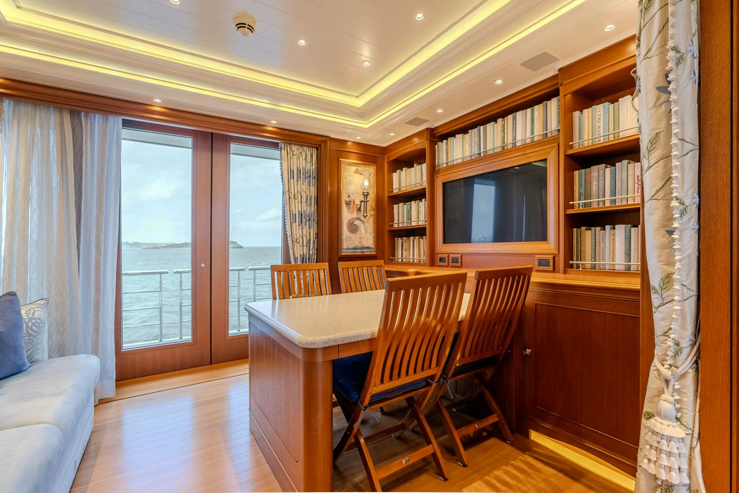 a room with a table and chairs aboard SEA OWL Yacht for Charter