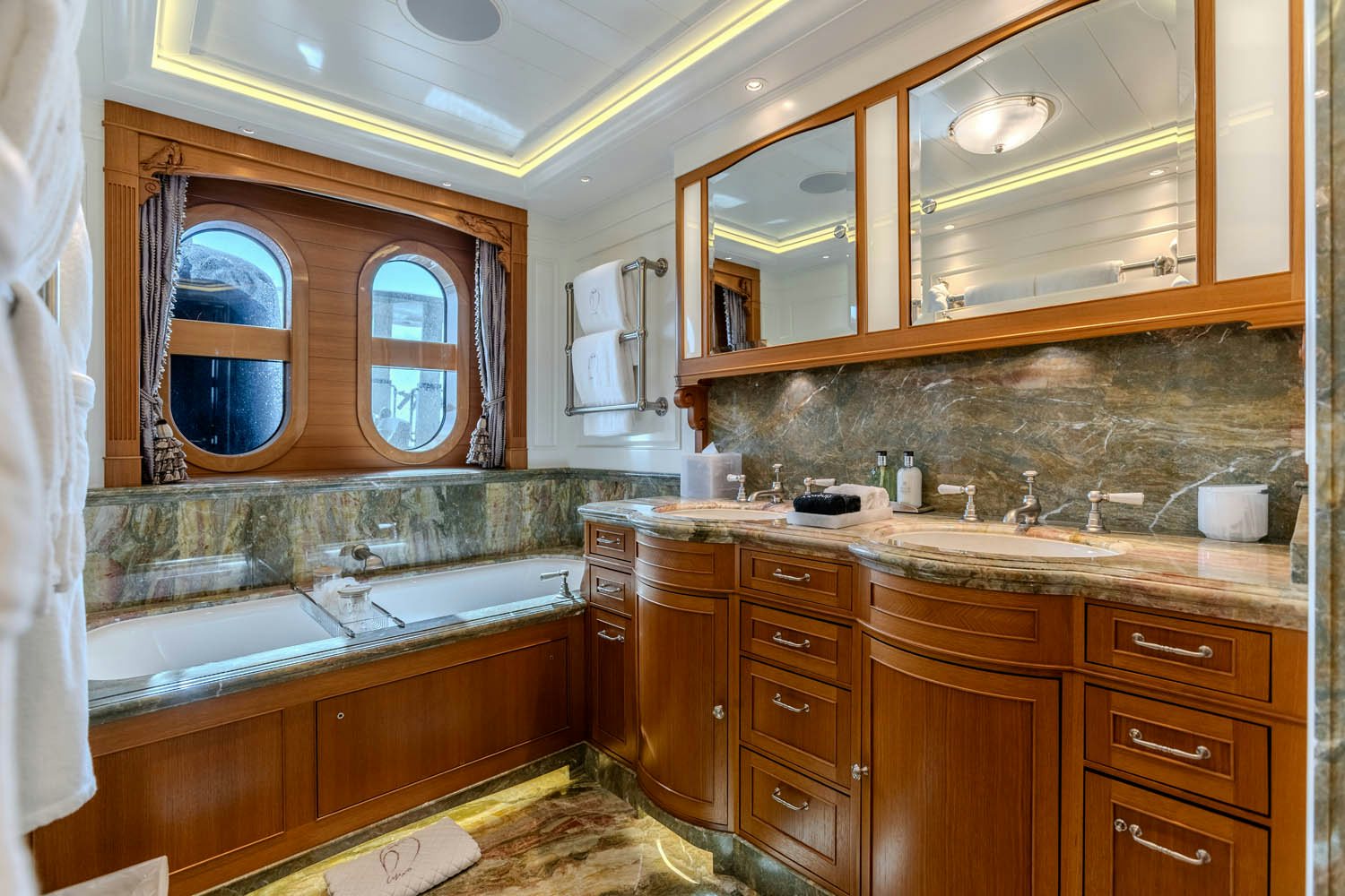 a bathroom with a large mirror aboard SEA OWL Yacht for Charter