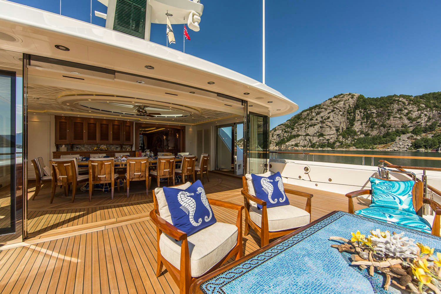 a deck with chairs and tables aboard SEA OWL Yacht for Charter