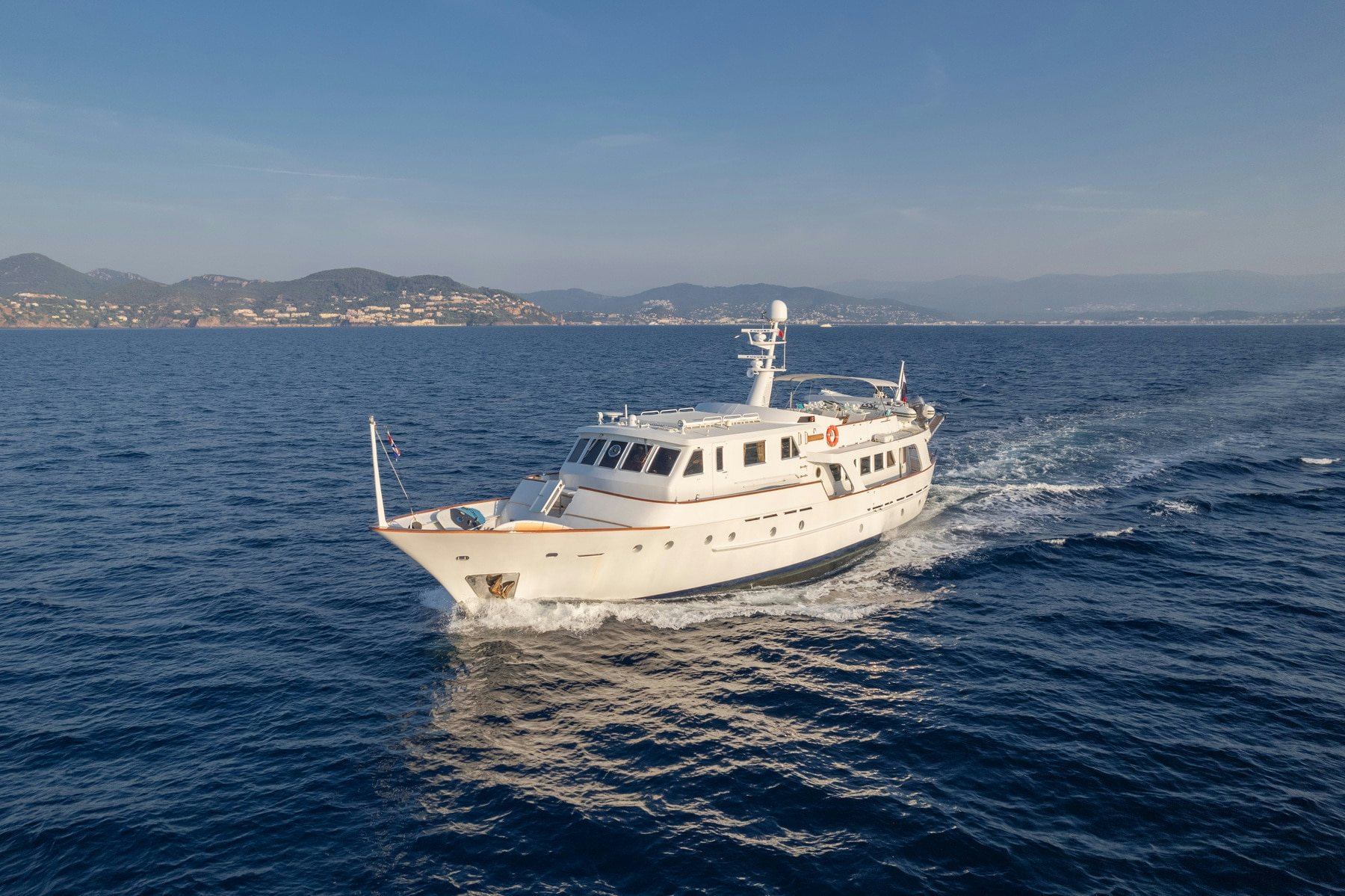 a white boat in the water aboard AMMIRAGLIO Yacht for Sale