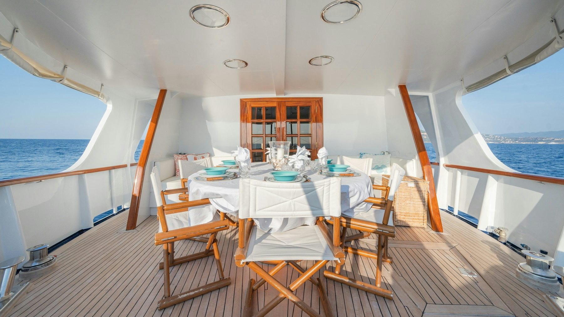 a room with a table and chairs aboard AMMIRAGLIO Yacht for Sale