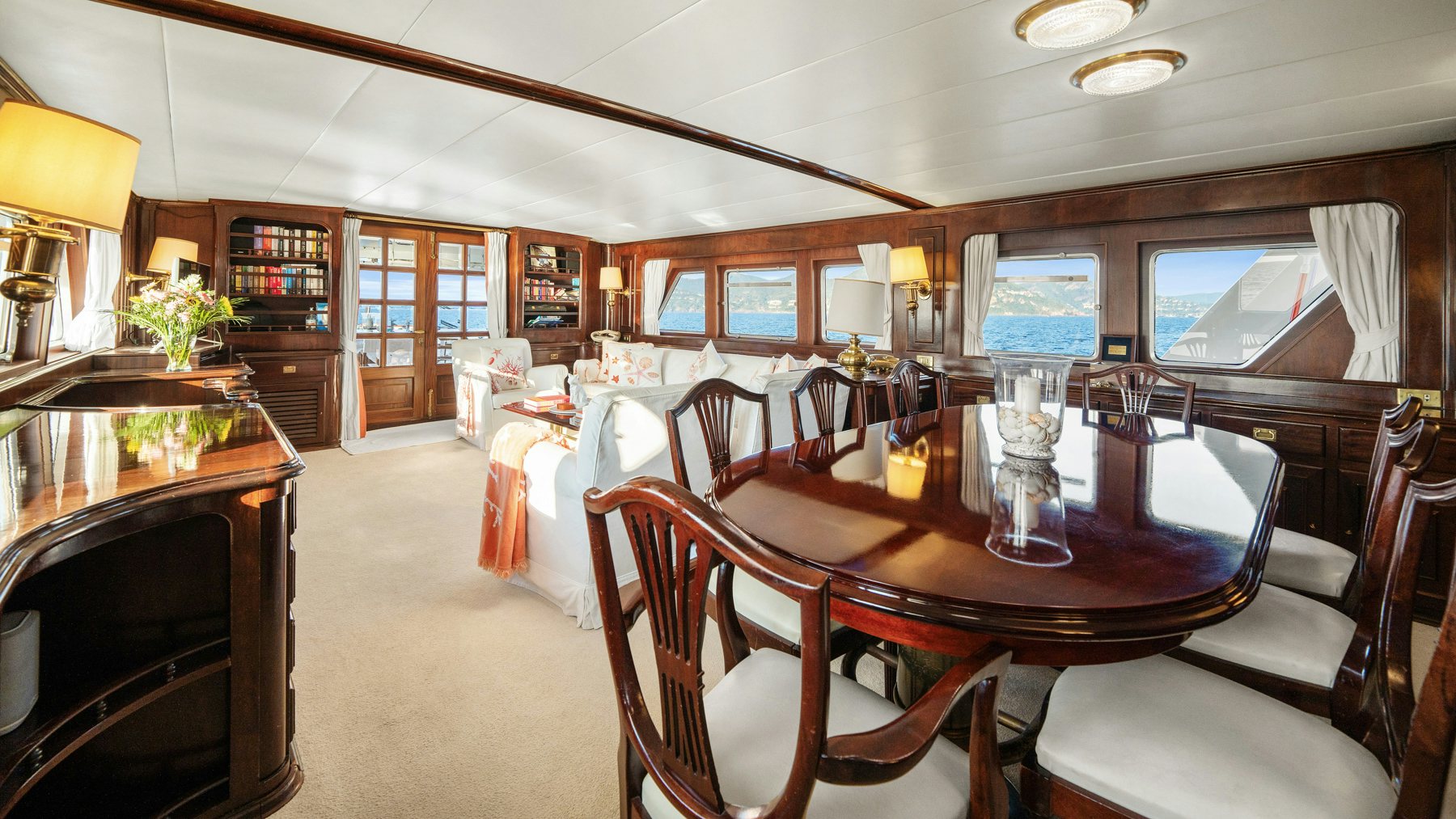a dining room with a table and chairs aboard AMMIRAGLIO Yacht for Sale