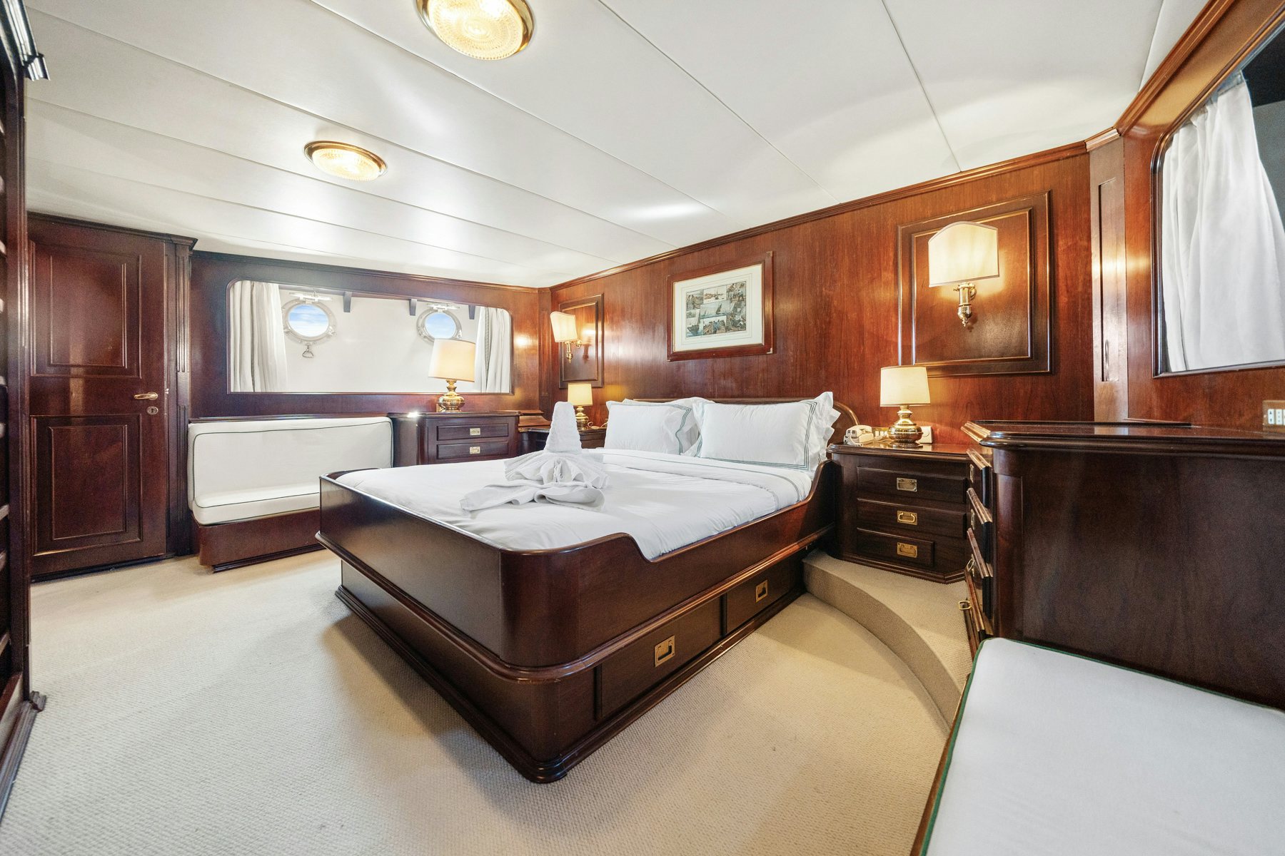 a bedroom with a bed and a mirror aboard AMMIRAGLIO Yacht for Sale