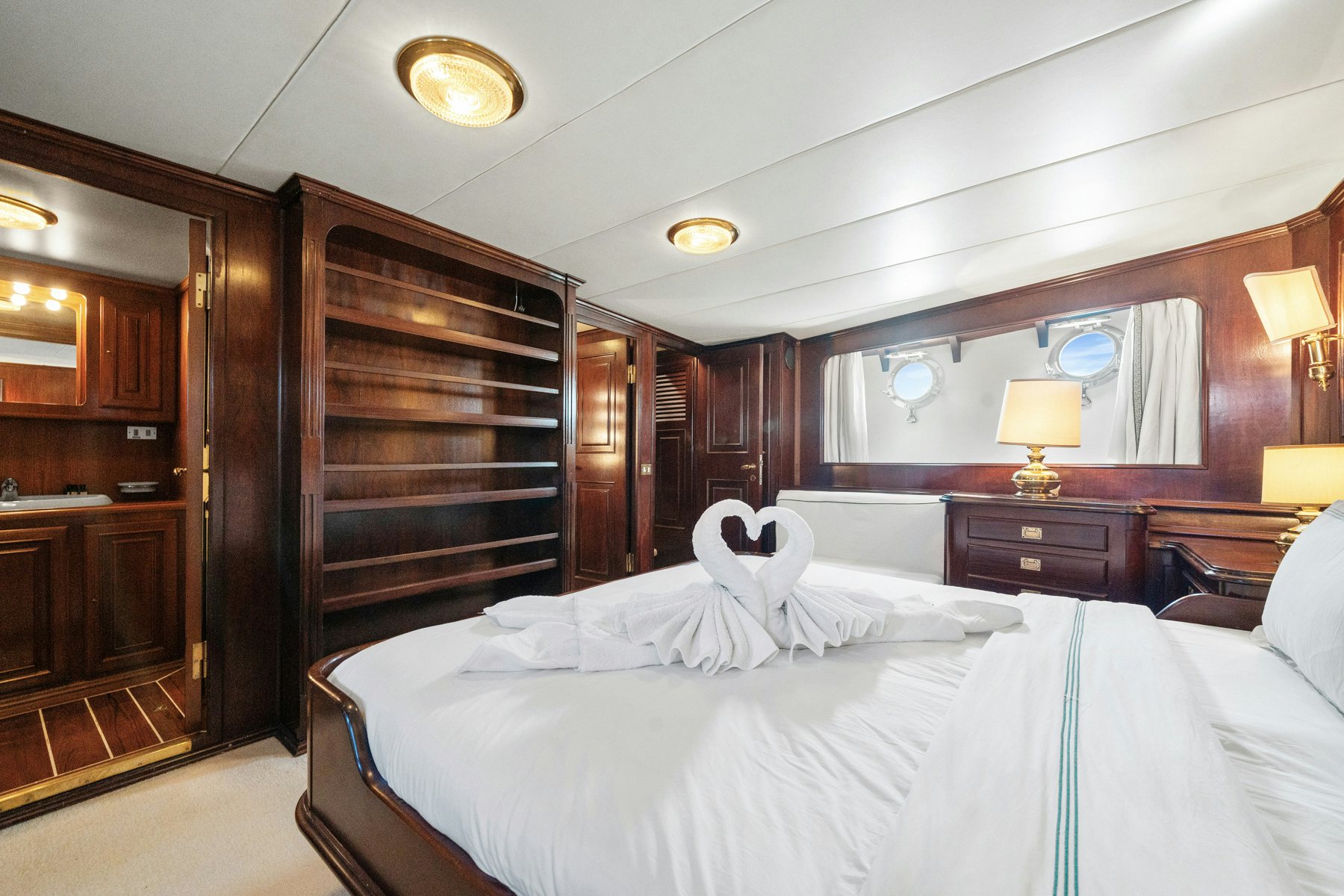 a bedroom with a large bed aboard AMMIRAGLIO Yacht for Sale