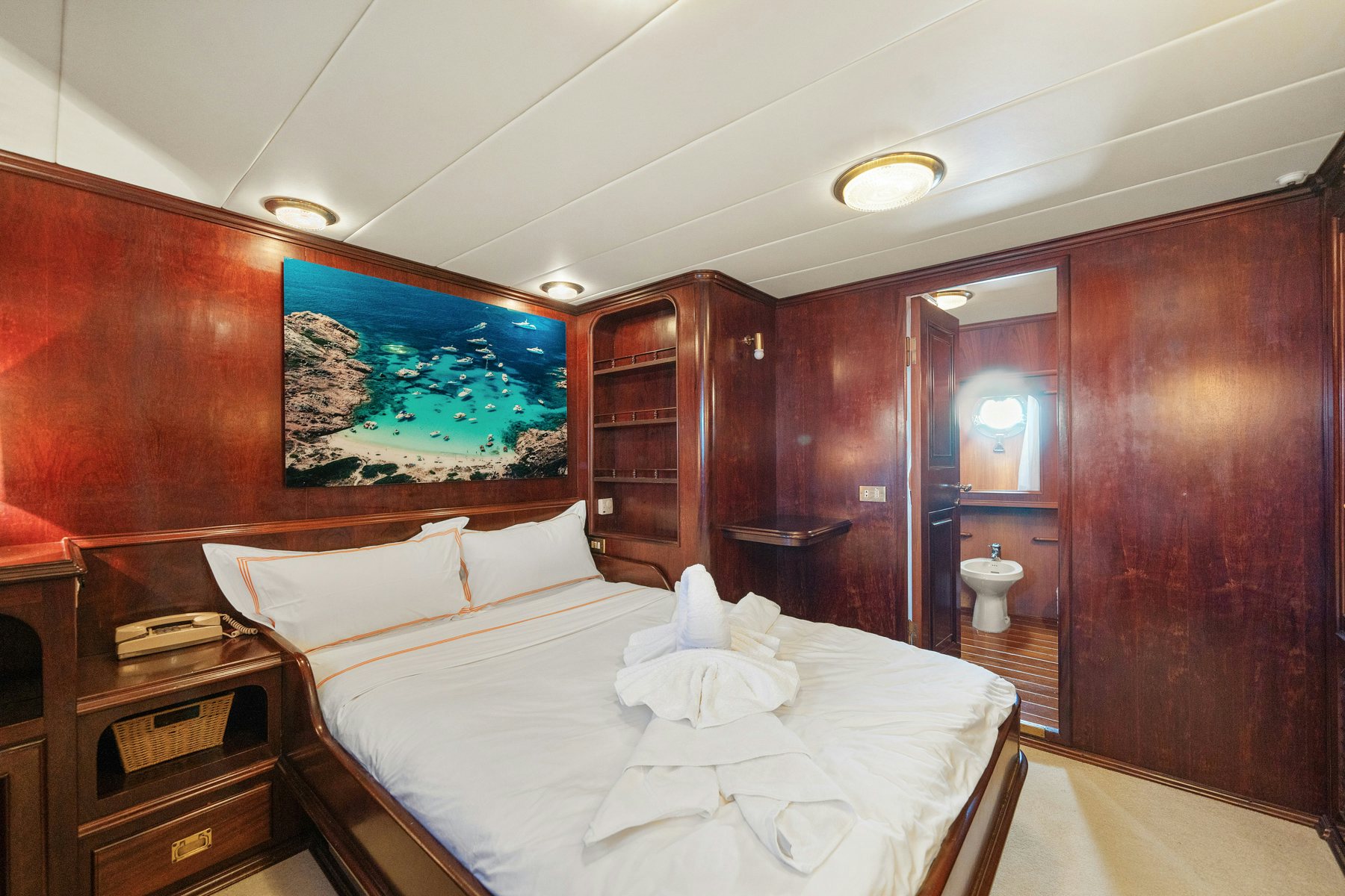 a bed in a room aboard AMMIRAGLIO Yacht for Sale