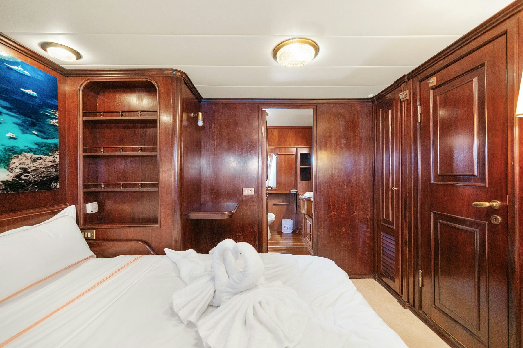 a bed in a room aboard AMMIRAGLIO Yacht for Sale