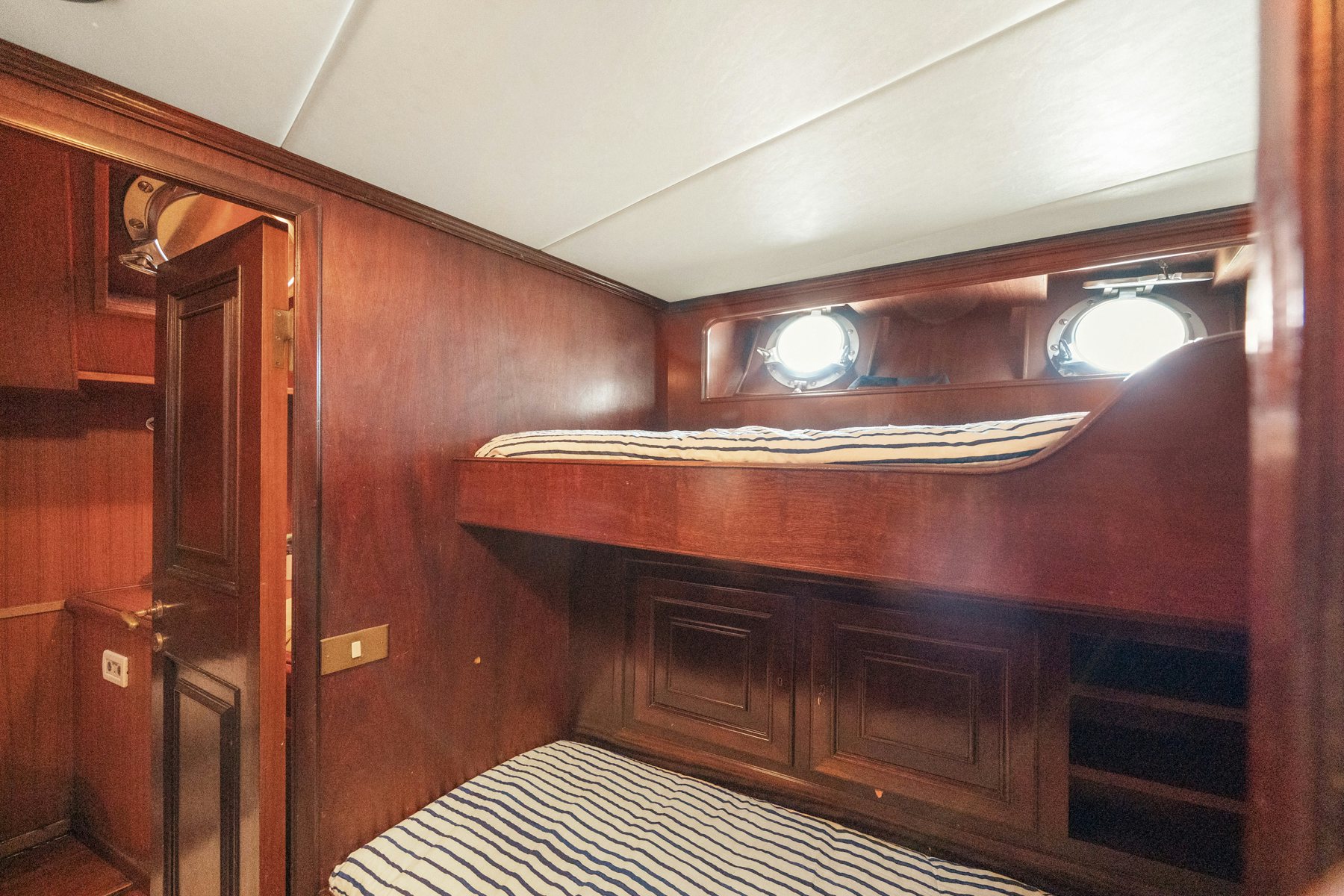 a room with wooden cabinets aboard AMMIRAGLIO Yacht for Sale