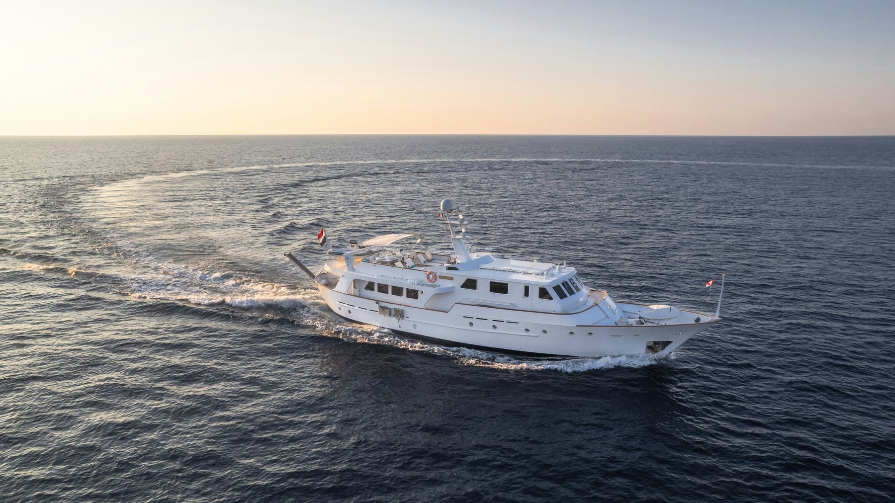 a white boat in the water aboard AMMIRAGLIO Yacht for Sale