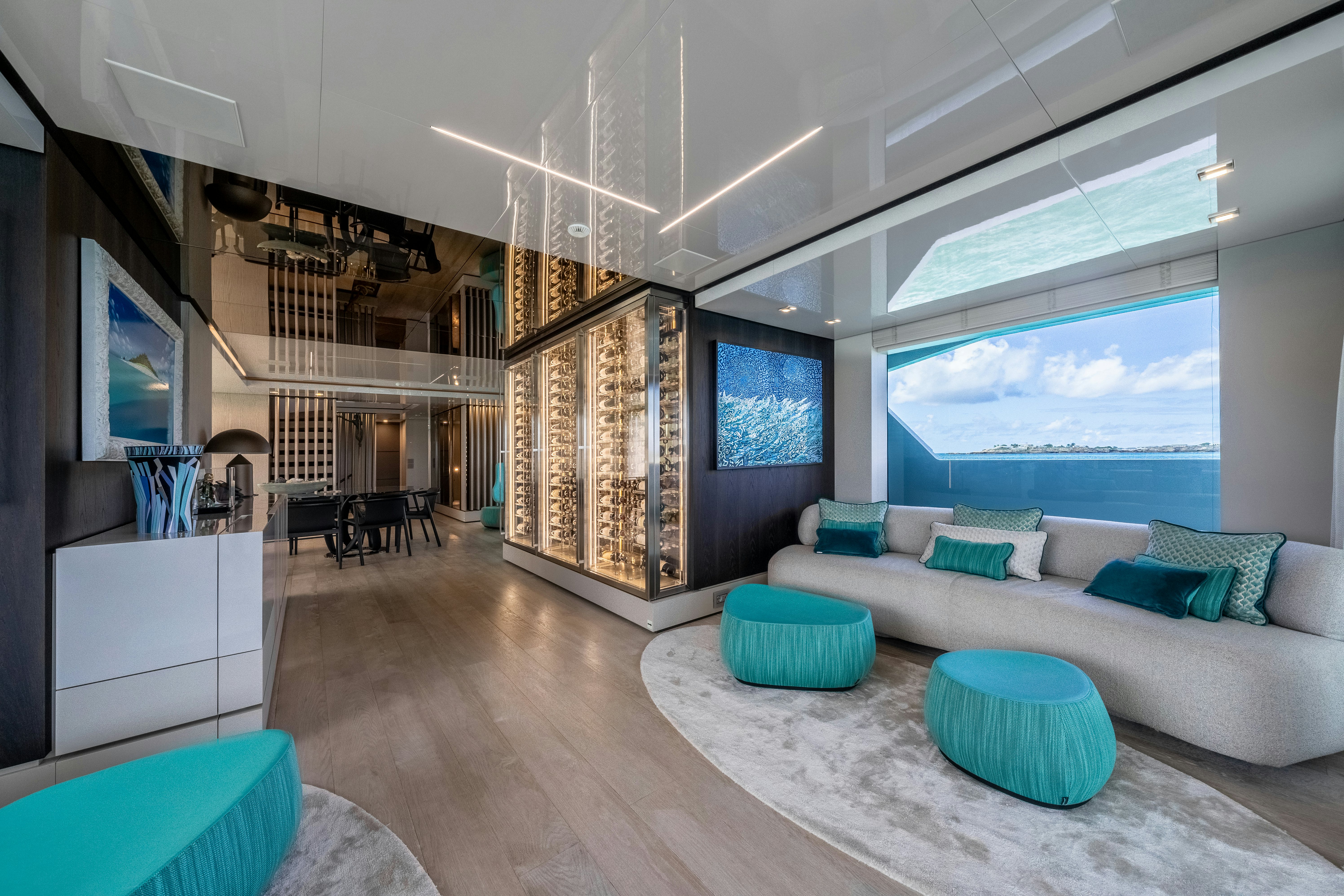 a room with a couch and a table aboard EMOCEAN Yacht for Sale