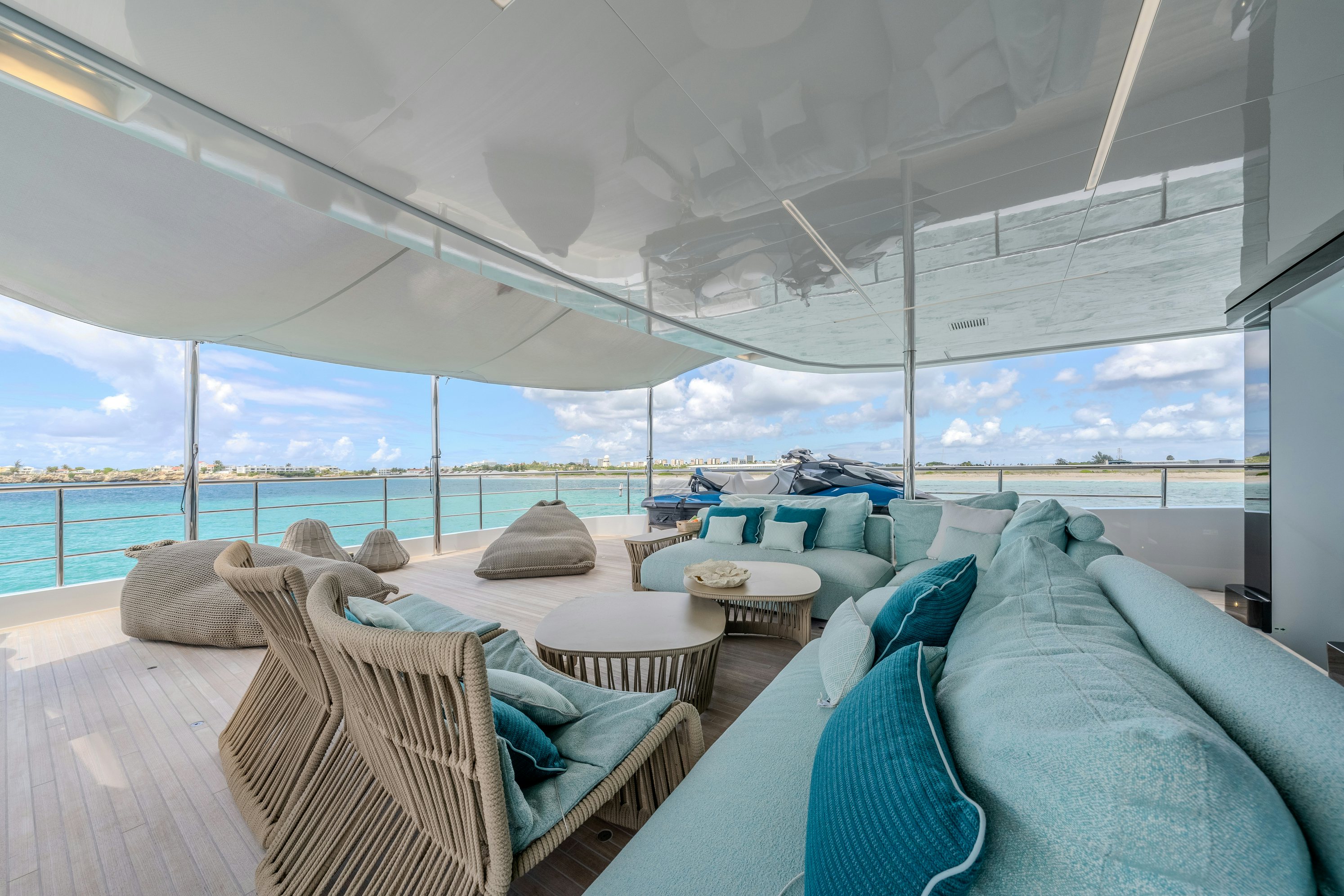 a room with a view of the ocean and the ocean aboard EMOCEAN Yacht for Sale