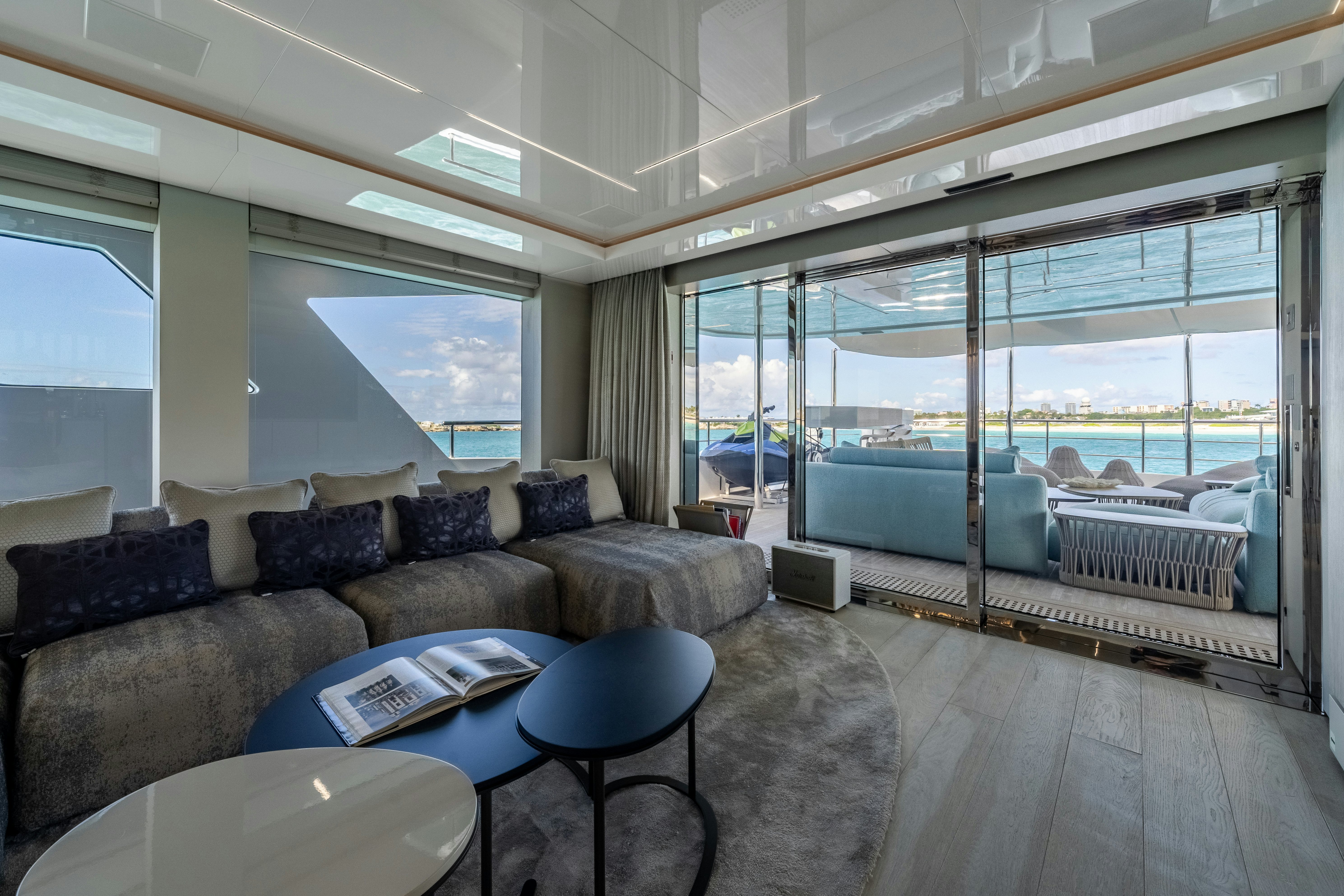 a living room with a large glass window aboard EMOCEAN Yacht for Sale