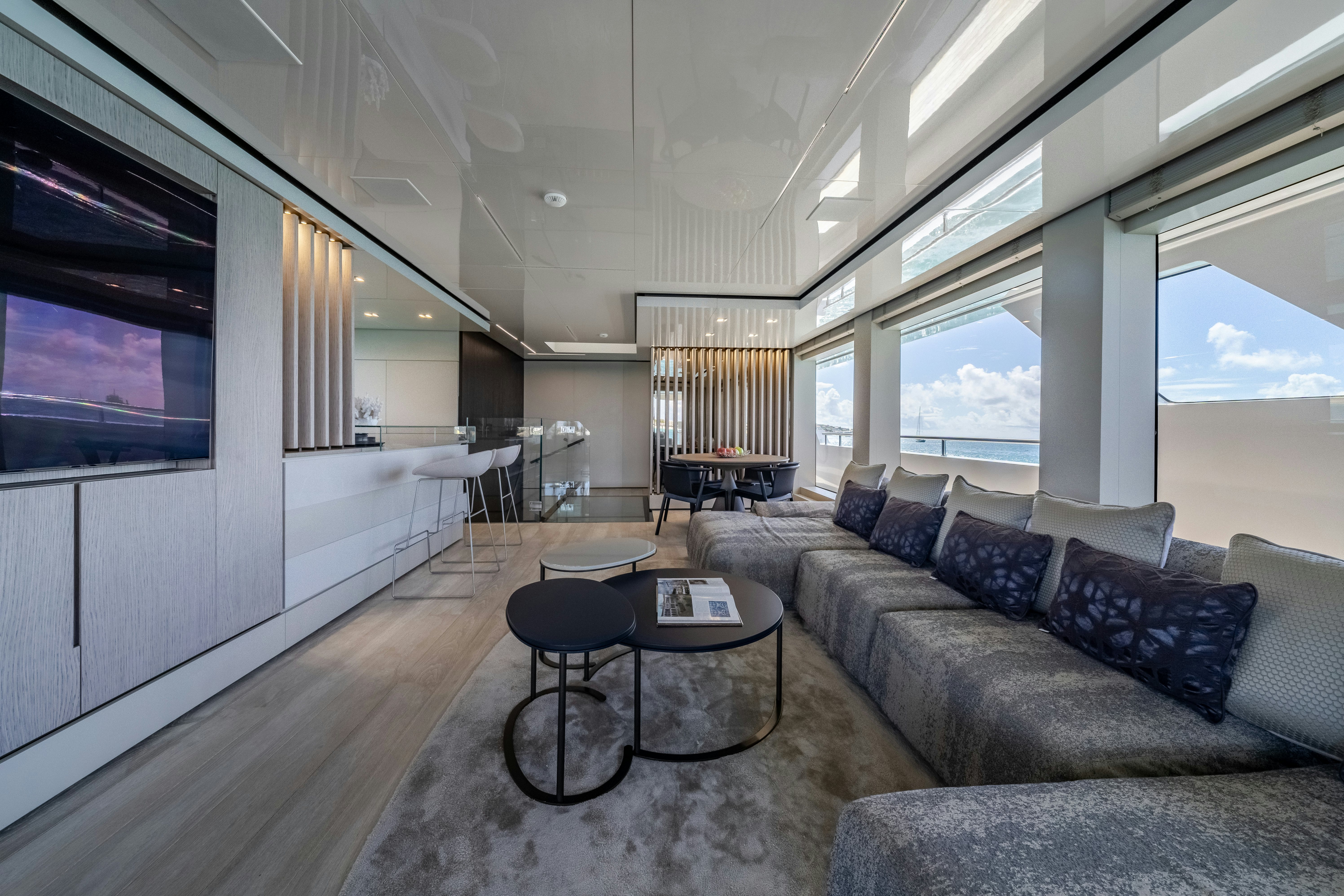 a living room with a couch and a table aboard EMOCEAN Yacht for Sale