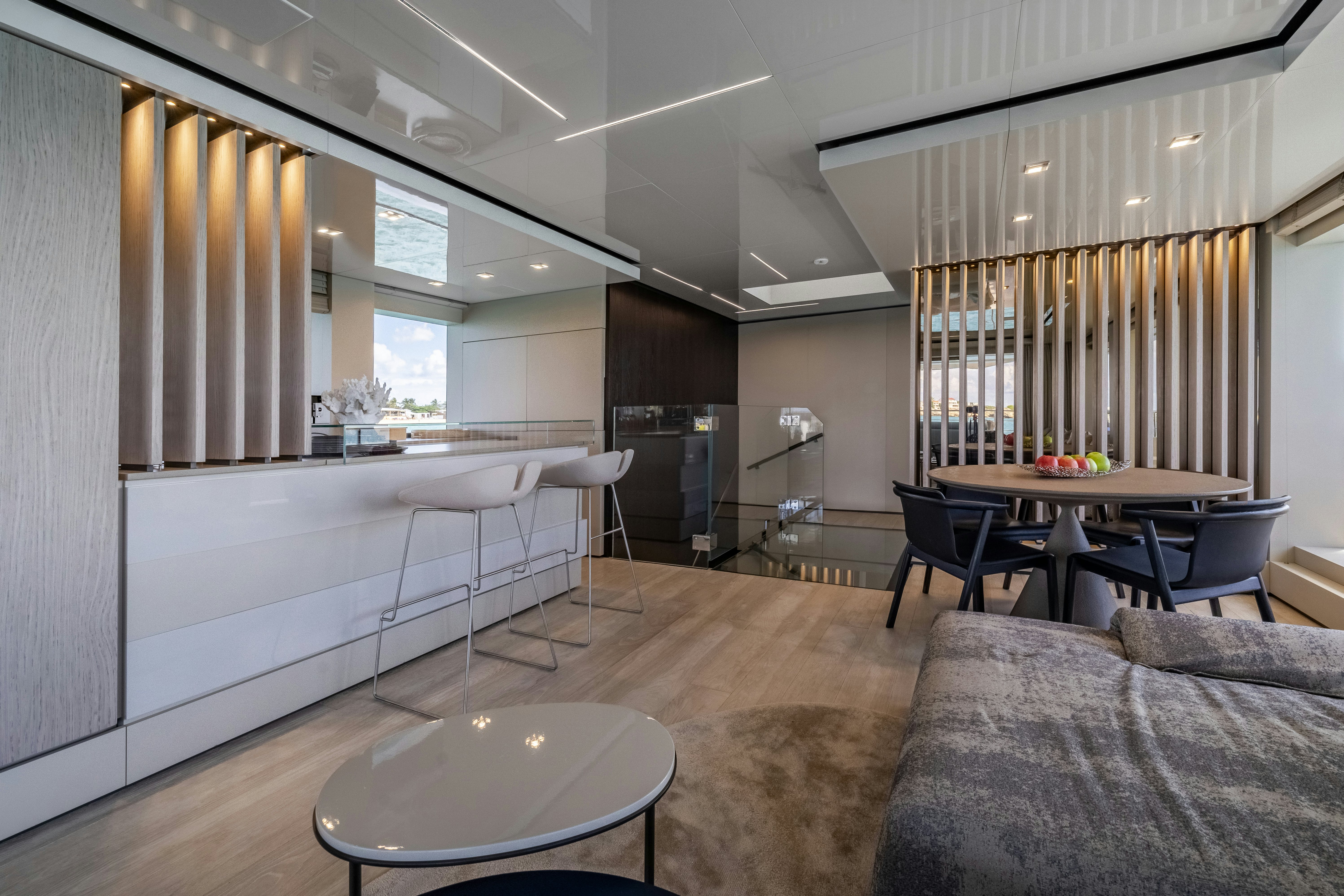 a room with a couch and a table and chairs aboard EMOCEAN Yacht for Sale