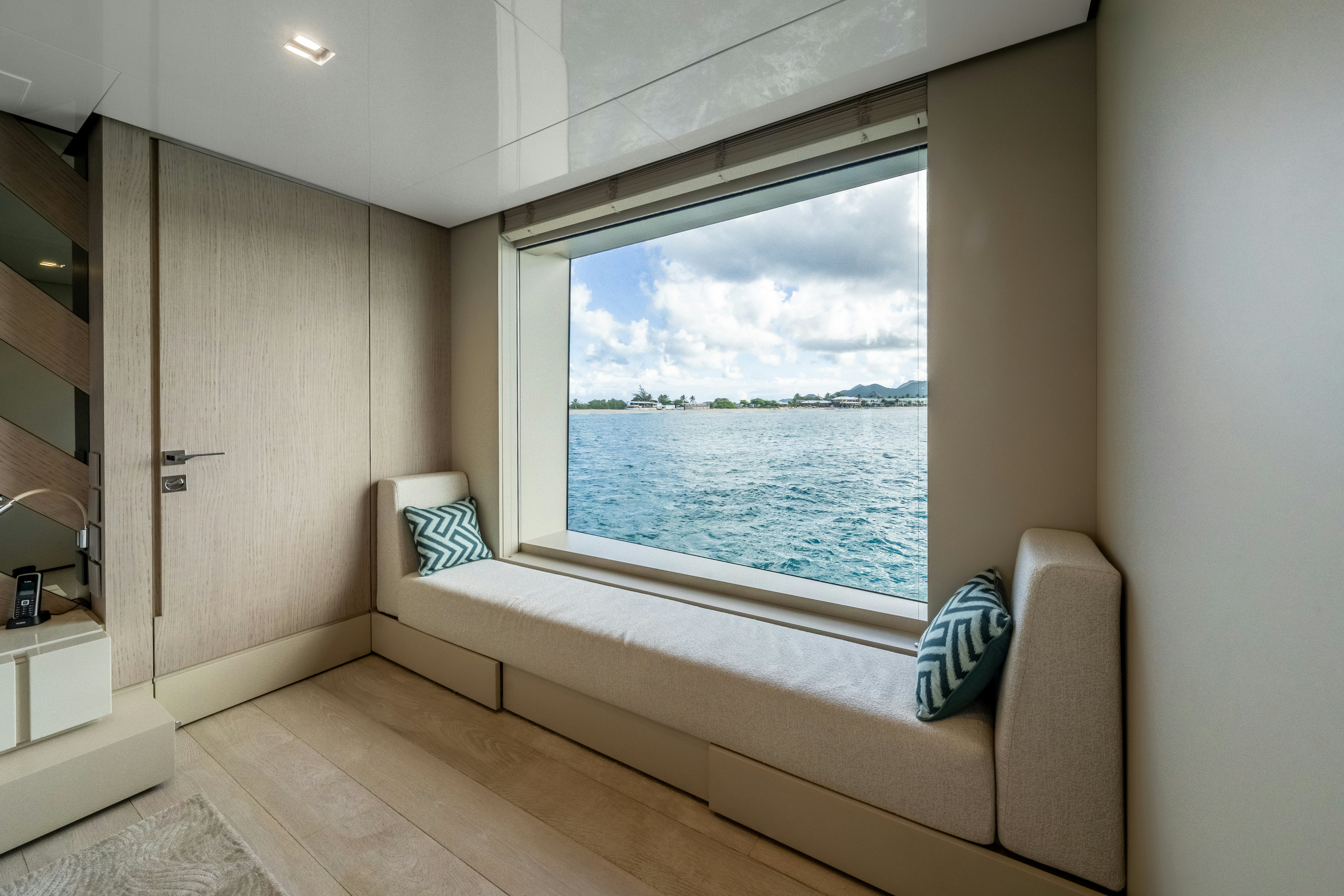 a room with a bed and a window aboard EMOCEAN Yacht for Sale