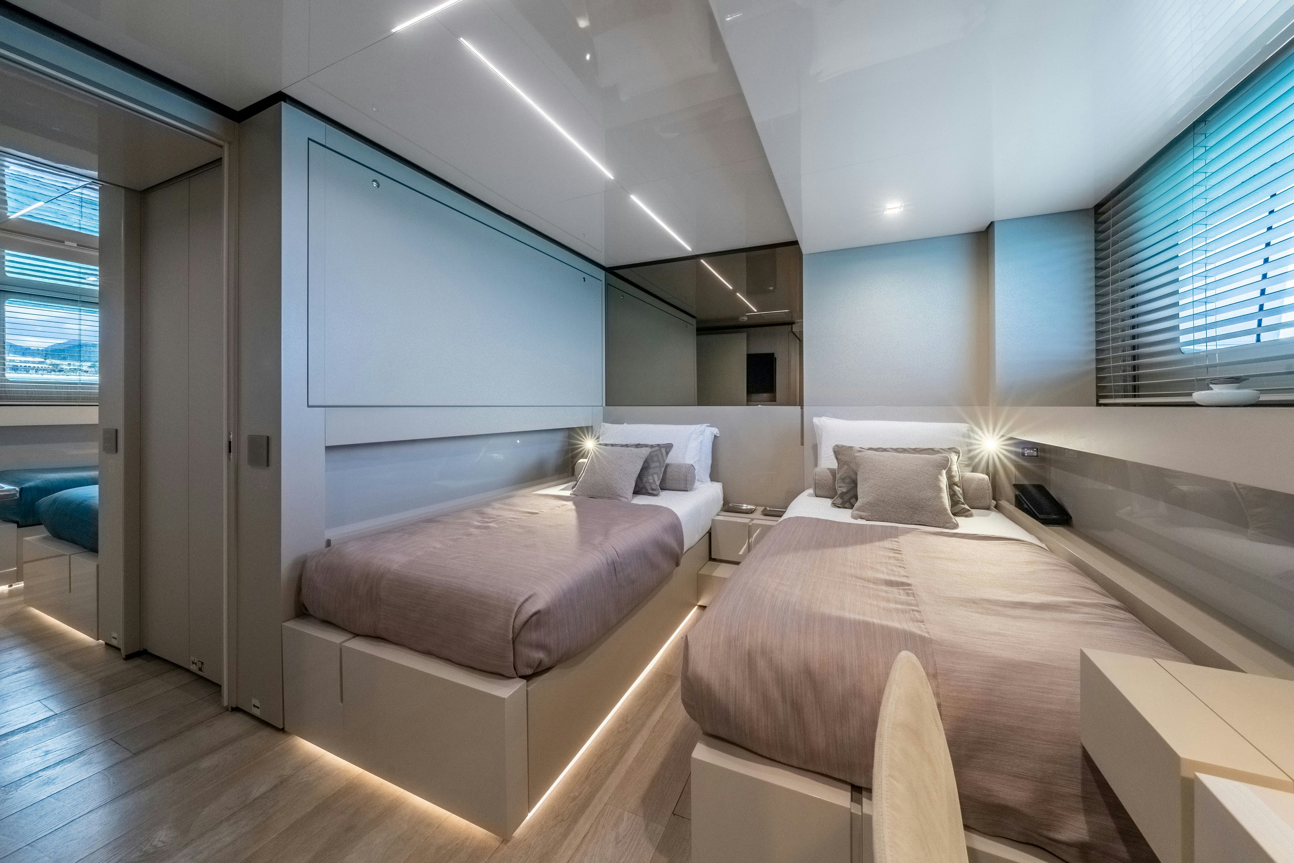 a room with a bed and a couch aboard EMOCEAN Yacht for Sale