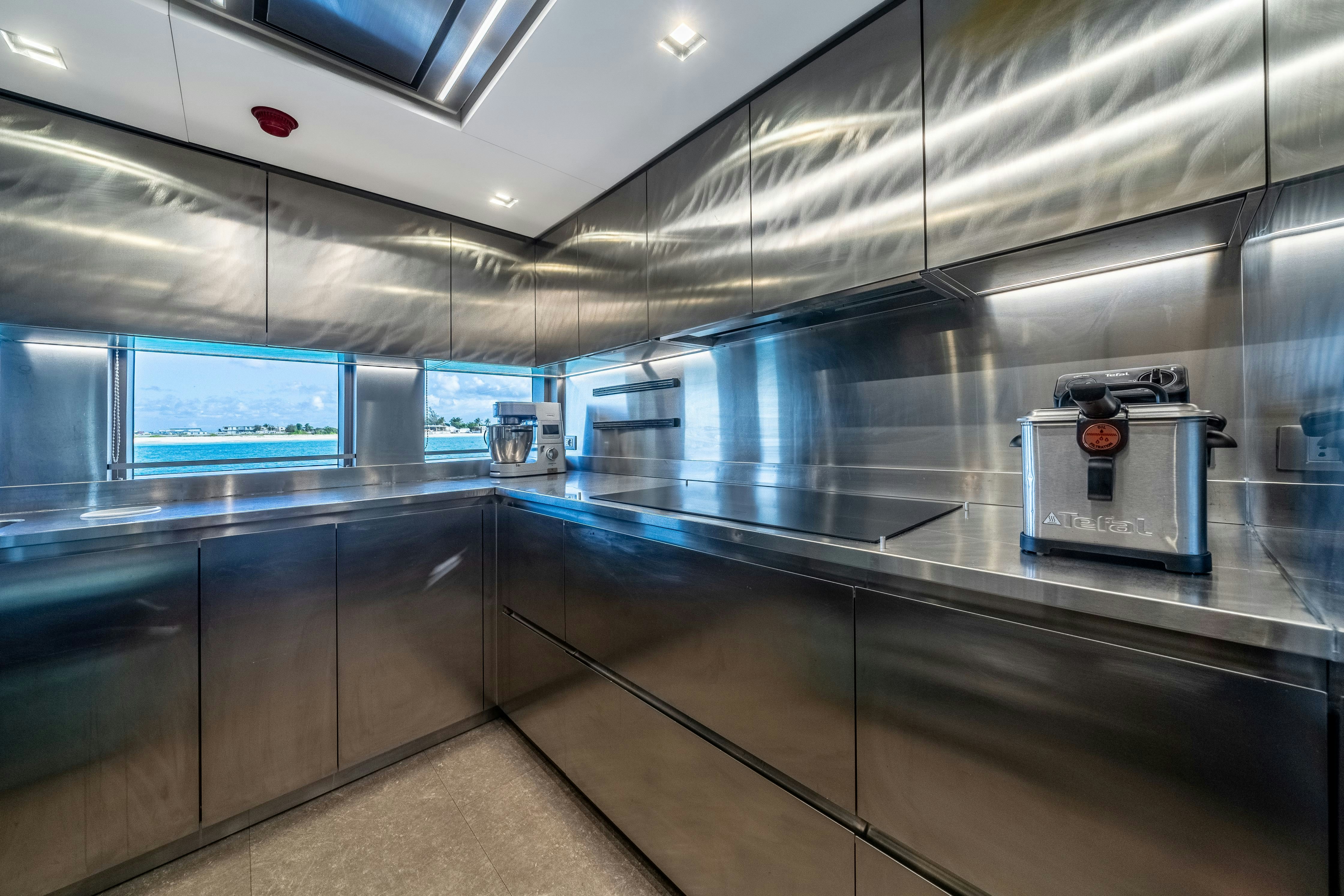 a kitchen with a counter and cabinets aboard EMOCEAN Yacht for Sale