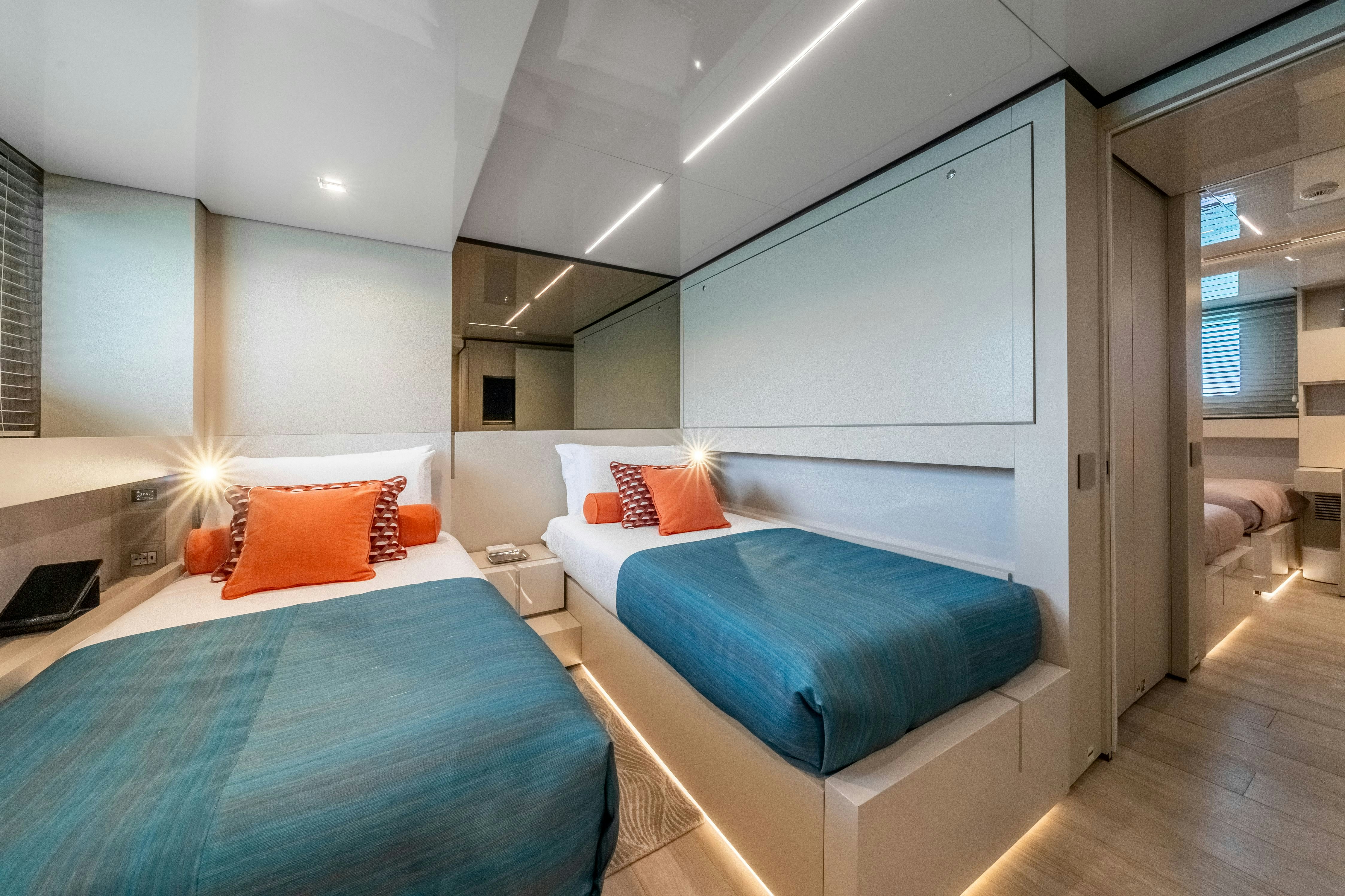 a room with two beds aboard EMOCEAN Yacht for Sale