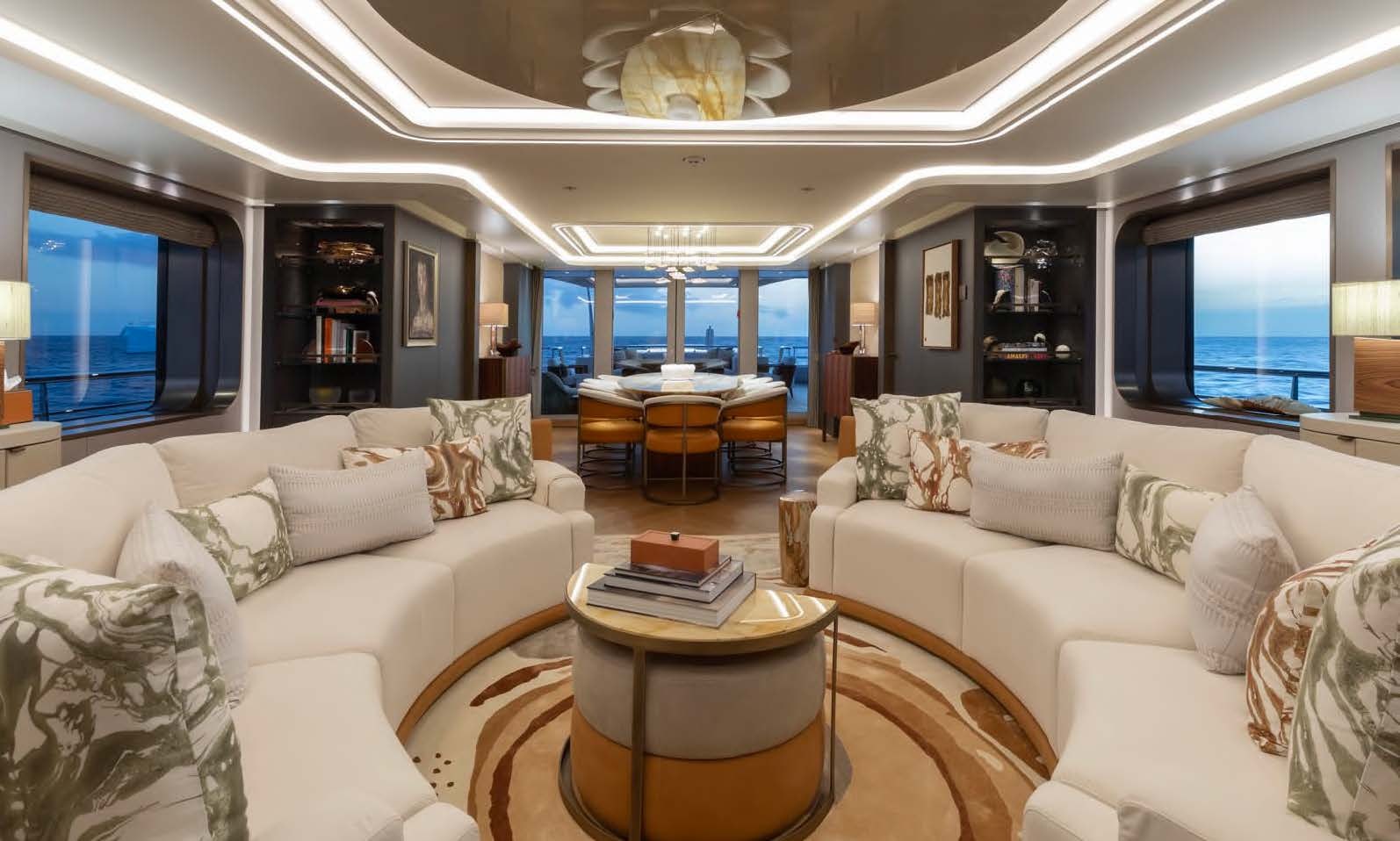 a living room with a couch and a table aboard MOONSTONE Yacht for Sale