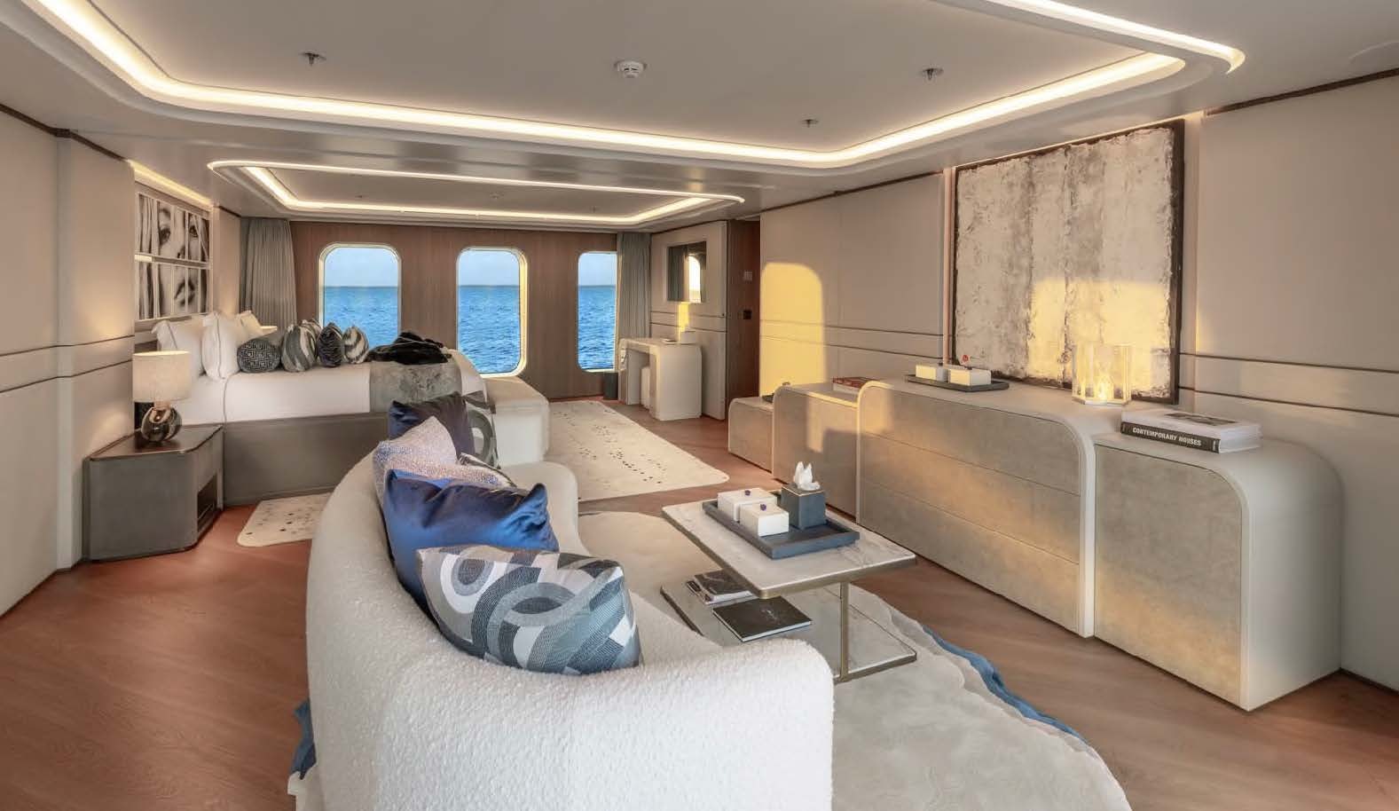 a living room with a couch and a table aboard MOONSTONE Yacht for Sale