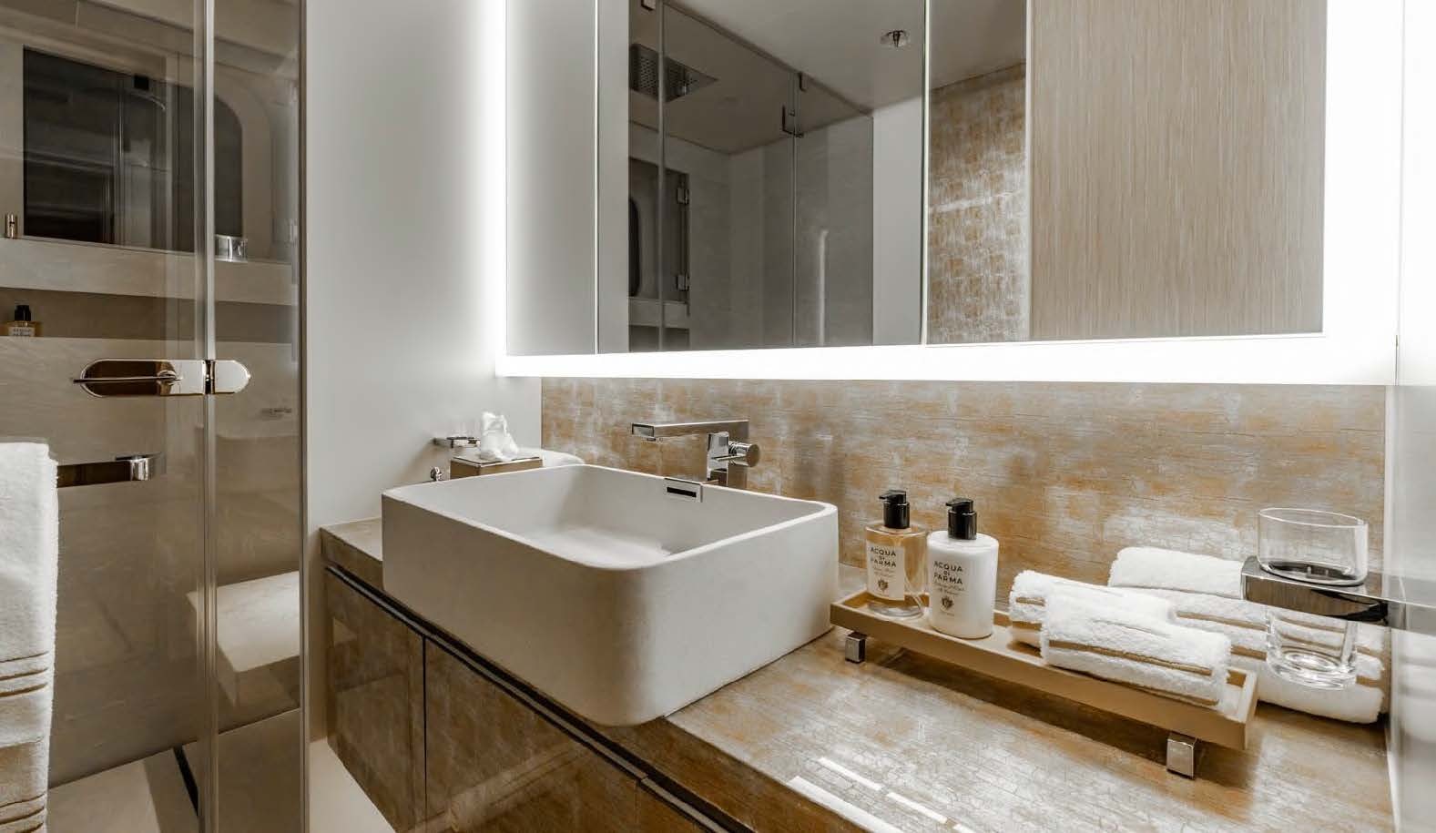 a bathroom with a sink and mirror aboard MOONSTONE Yacht for Sale