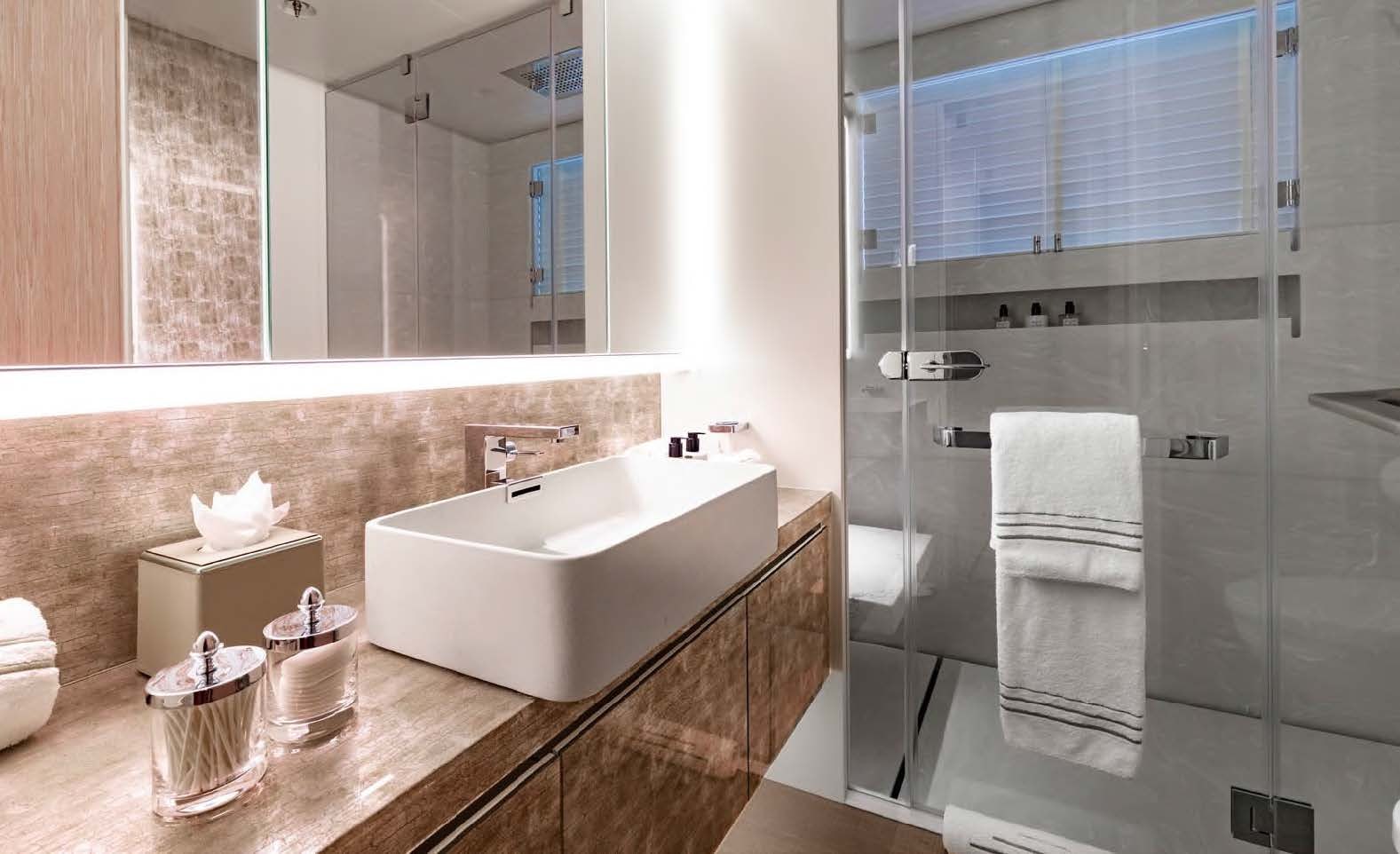 a bathroom with a glass shower aboard MOONSTONE Yacht for Sale