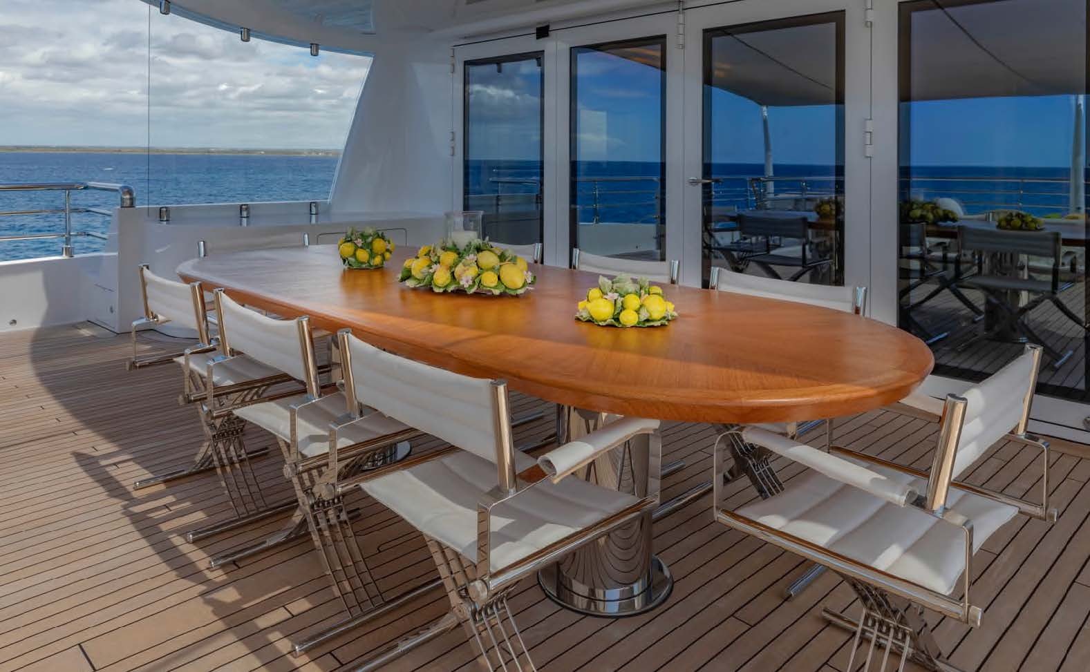 a table with chairs around it aboard MOONSTONE Yacht for Sale