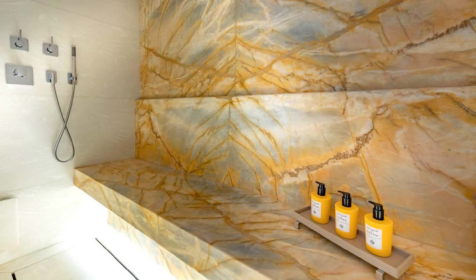 a wall with a rock wall and a few bottles of oil aboard MOONSTONE Yacht for Sale