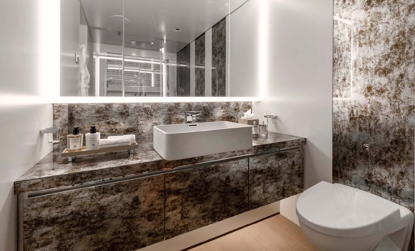 a bathroom with a sink and a toilet aboard MOONSTONE Yacht for Sale