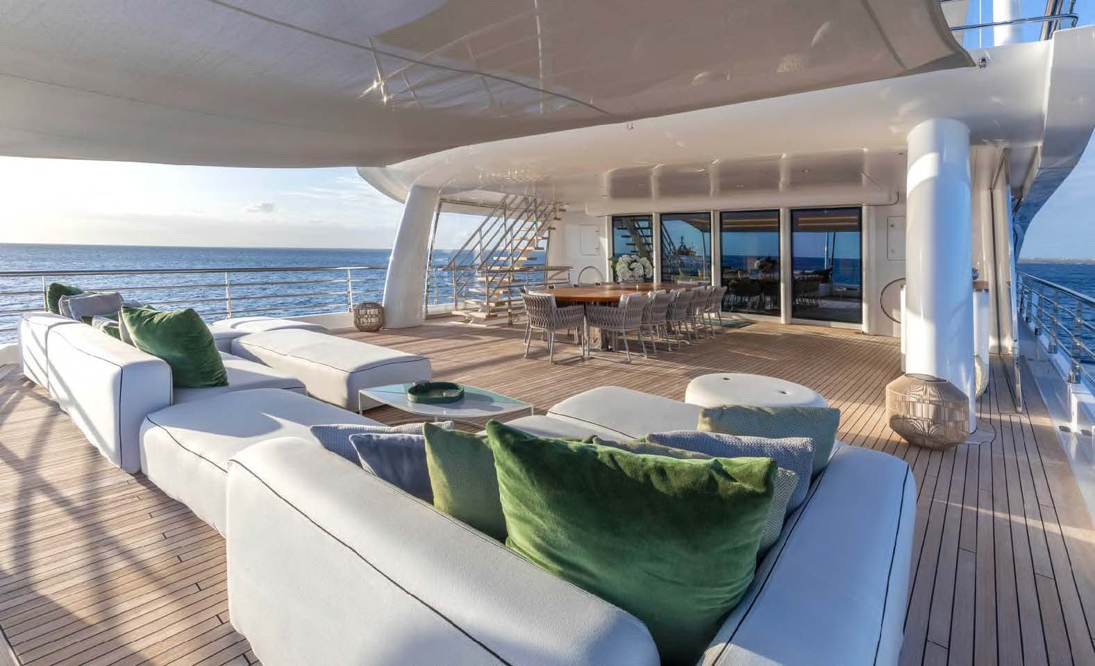 a large living room with a large balcony aboard MOONSTONE Yacht for Sale
