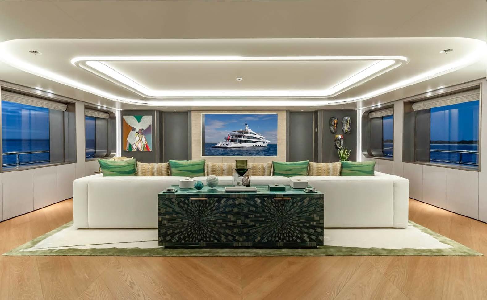 a living room with a large white couch aboard MOONSTONE Yacht for Sale