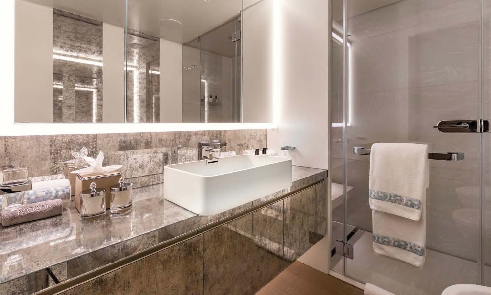 a bathroom with a large mirror aboard MOONSTONE Yacht for Sale