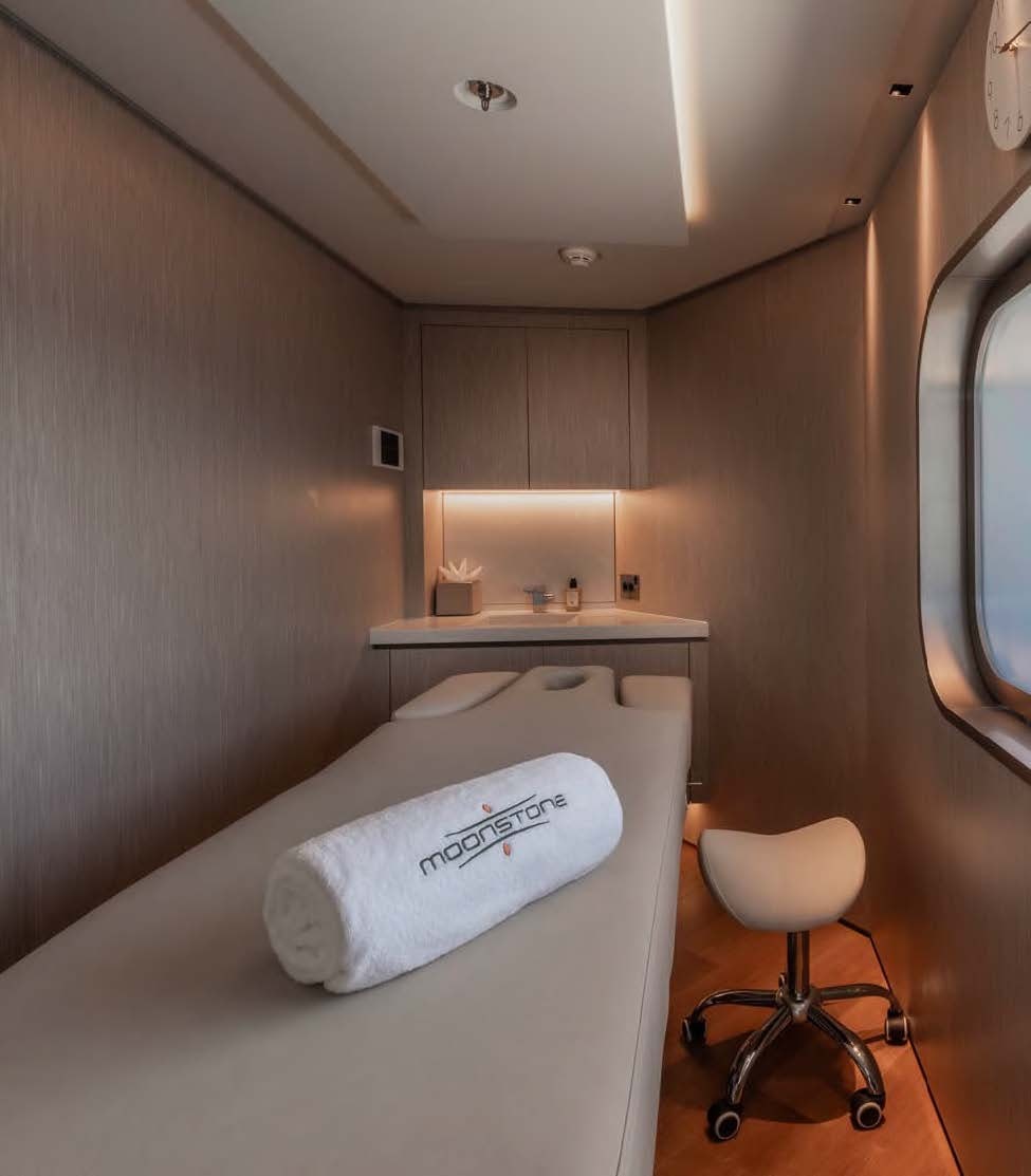a room with a bed and a chair aboard MOONSTONE Yacht for Sale