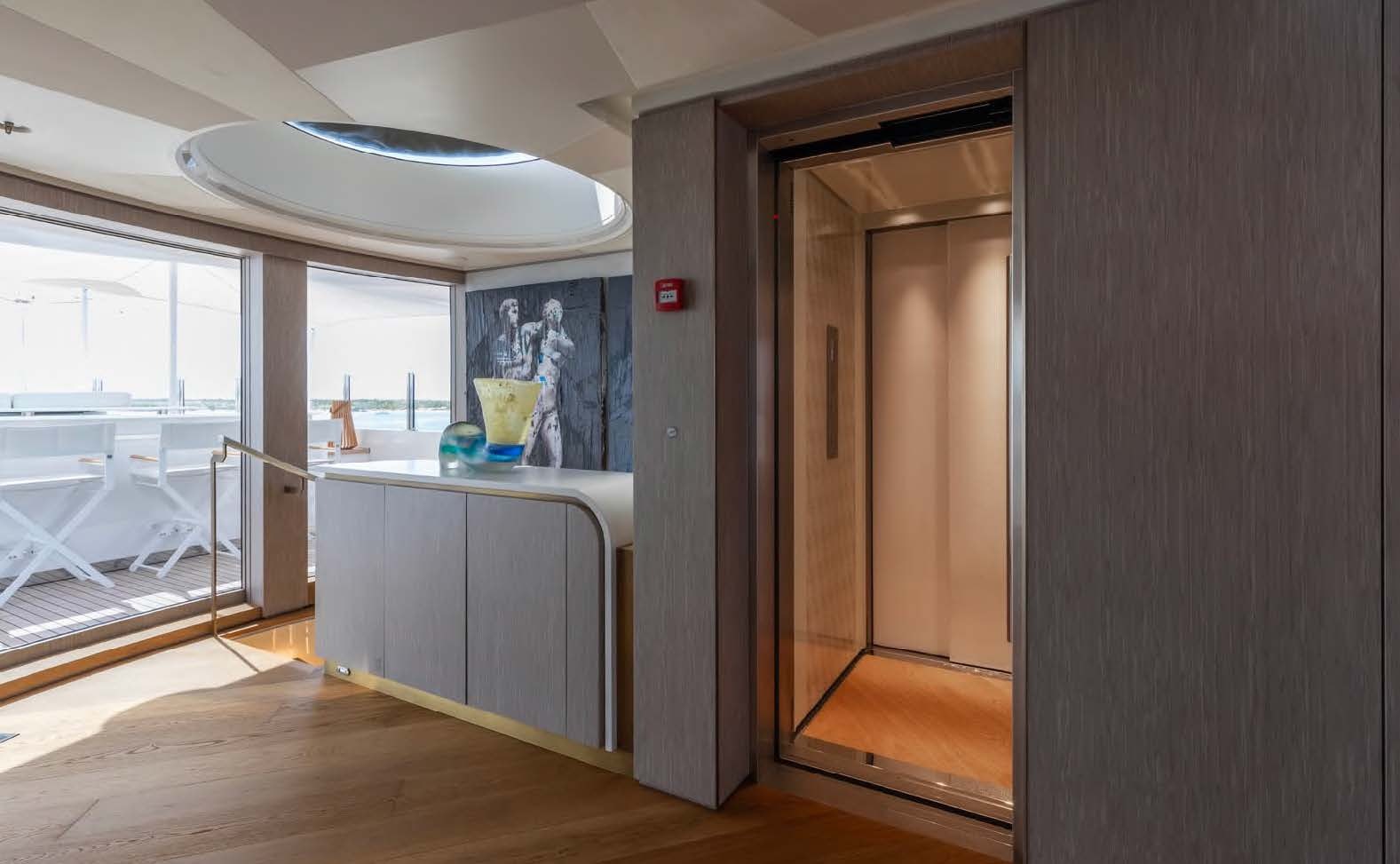 a kitchen with a large window aboard MOONSTONE Yacht for Sale