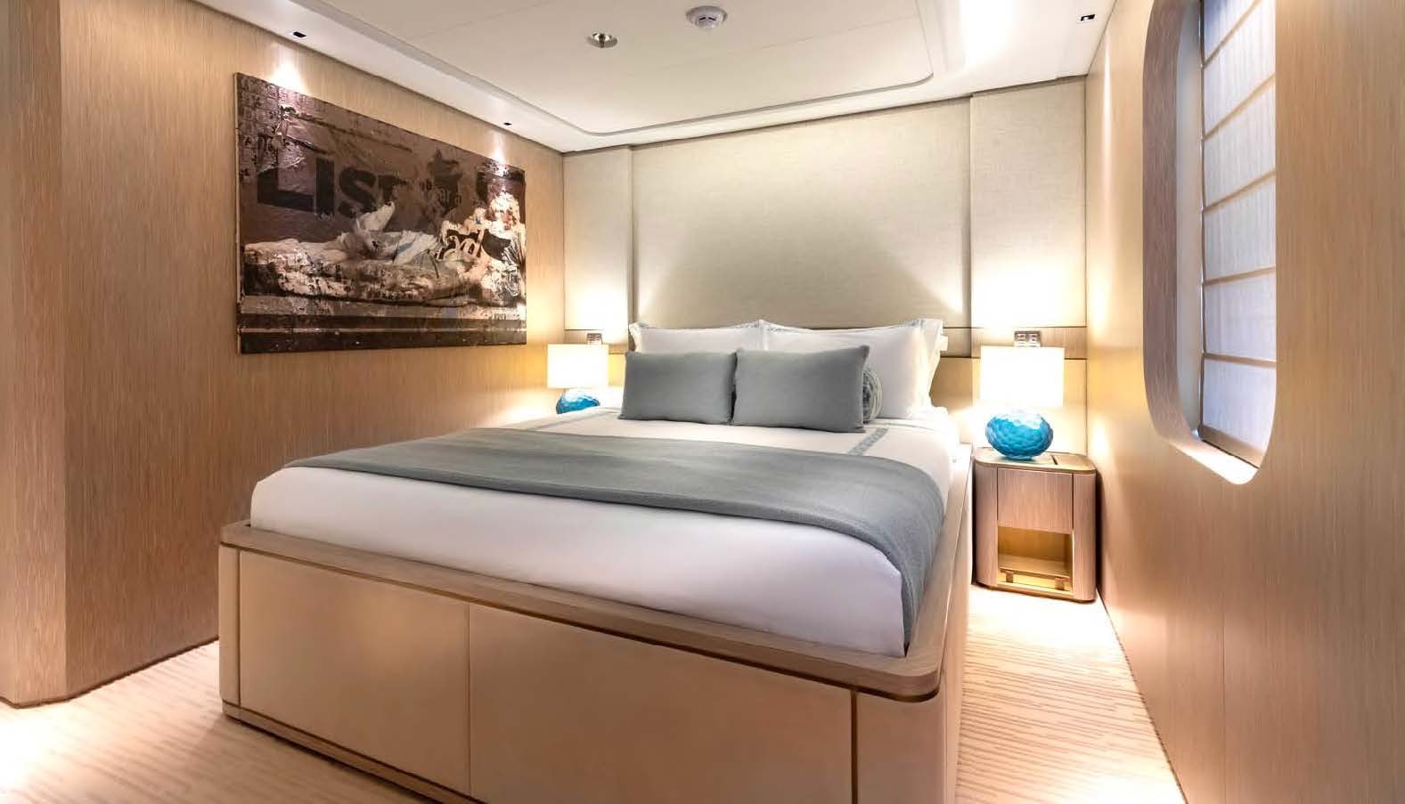 a bed with a white sheet aboard MOONSTONE Yacht for Sale