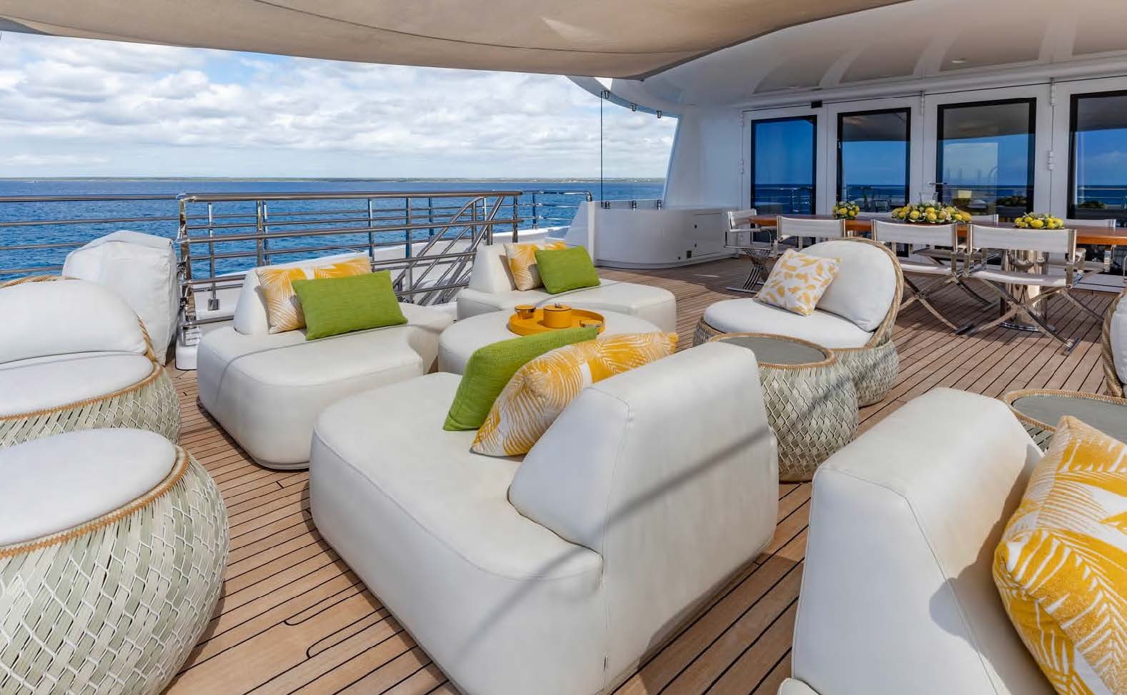 a living room with a large balcony aboard MOONSTONE Yacht for Sale