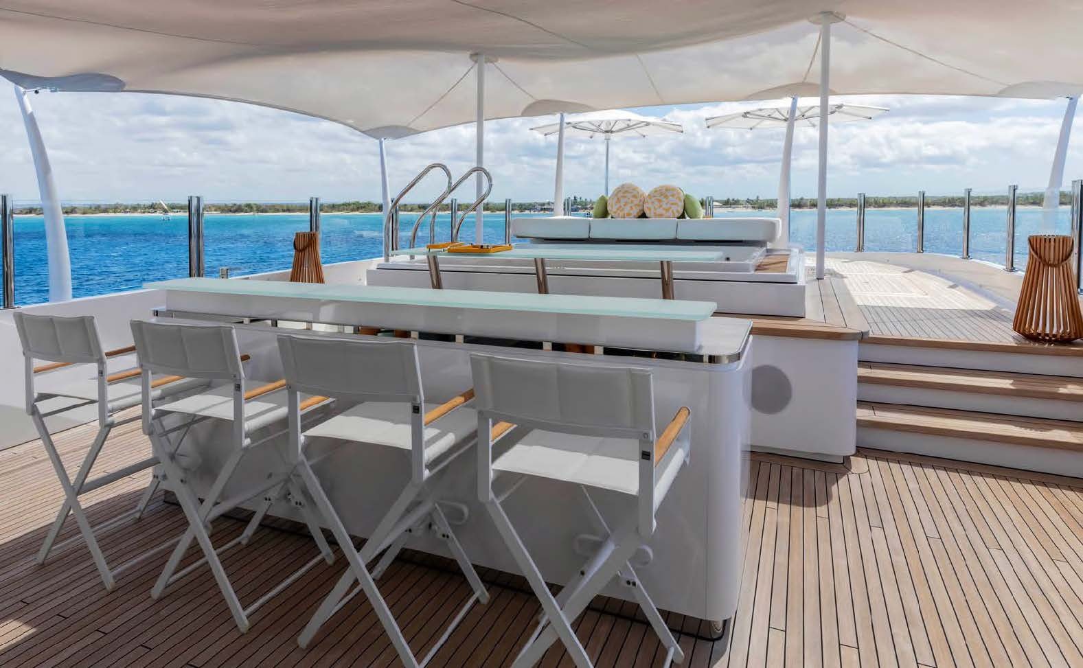 a table and chairs on a deck aboard MOONSTONE Yacht for Sale